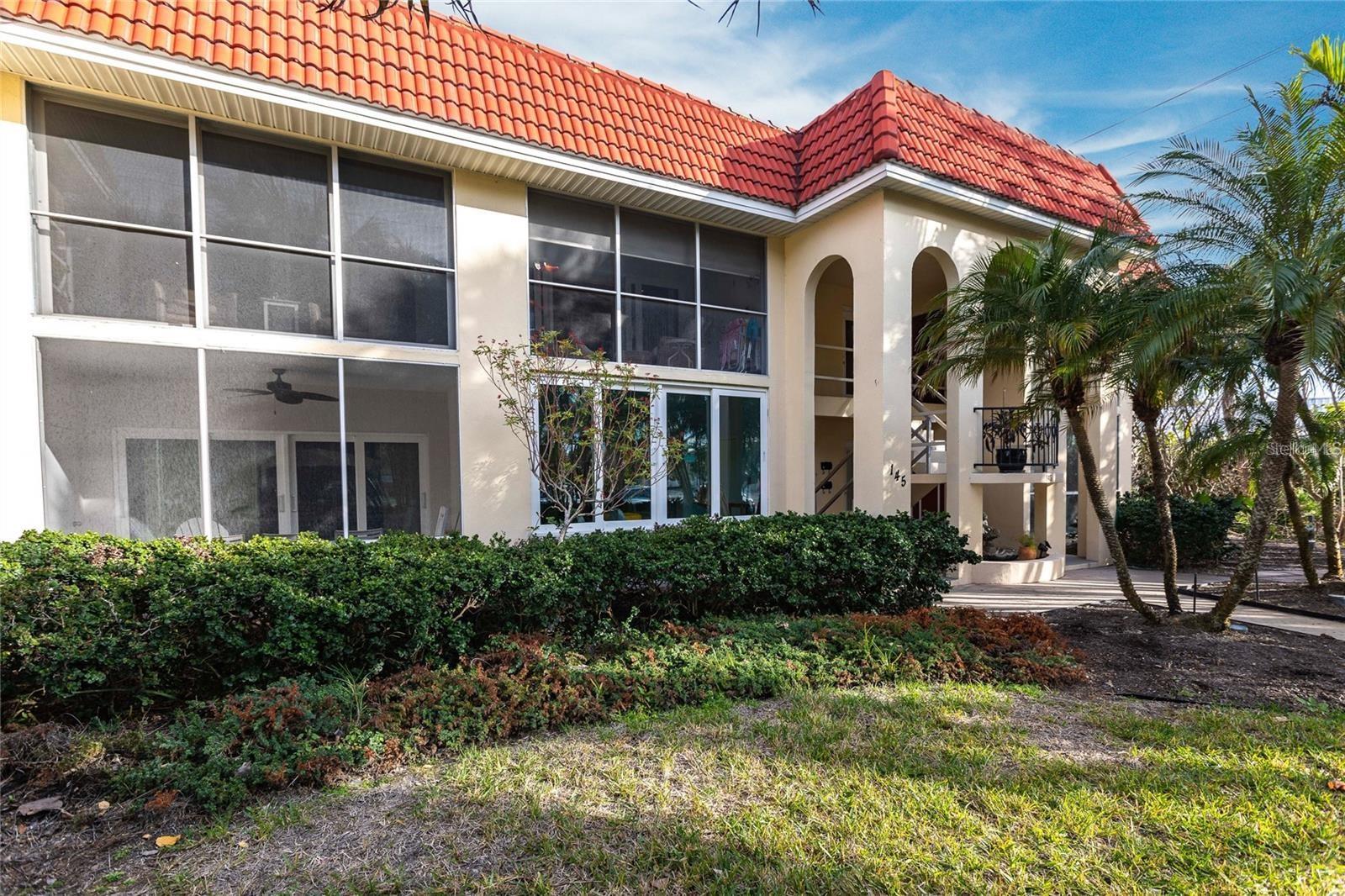 Welcome to this wonderful condominium complex directly on the edge of the Siesta Key Village! This UPSTAIRS unit has been completely remodeled from top to bottom and is absolutely stunning! The opened kitchen features stainless steel appliances, handsome quartz counters, and a tan tiger-look cabinetry. There is all new lighting, fans, receptacles and switches, and a neutral plank-like ceramic tile flooring throughout. The guest bath was completely remodeled along with the primary bathroom that has been expanded for a little extra elbow room. This has a new water heater and HVAC system, new roof in 2024, all new doors, impact windows, ceiling texture and it doesn't stop there. This comes very tastefully turnkey furnished in a warm coastal theme! Relax on your screened patio and look out to palms and foliage and take in the gulf breezes. The pristine beach is 2/10 of a mile away and the SK Village is about 100 feet away with a large selection of restaurants, shopping, grocery, nightlife, and so much more! Don't miss this beautiful condo in the heart of all that Siesta Key has to offer in a very well-run complex.