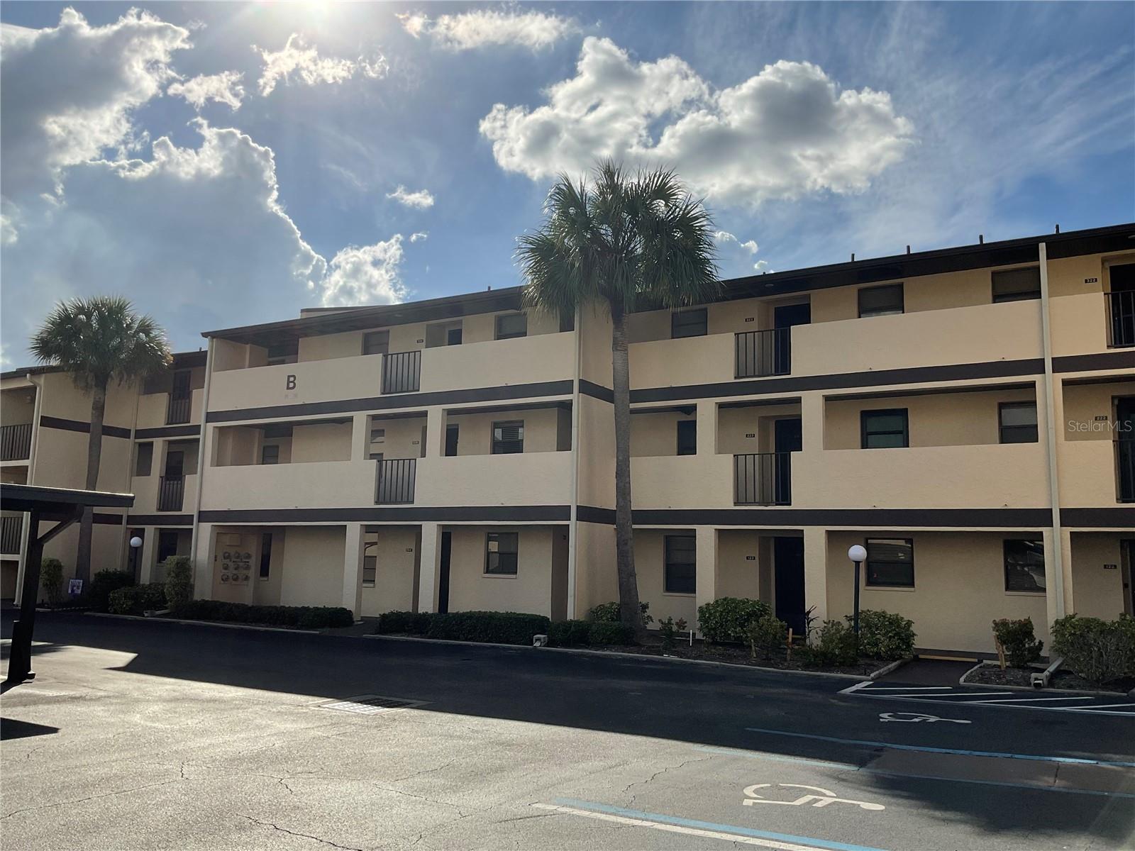 Vel Gardens is an inviting 55+ community featuring an active clubhouse and a heated pool. This beautifully furnished 2-bedroom, 2-full bath condo is located on the 2nd floor with an elevator, and ready for immediate occupancy! A brand new stackable washer/dryer inside the unit . The bright and airy kitchen boasts a new dishwasher and recently upgraded countertops, a window overlooking your assigned covered parking space, and ample guest parking is also available. Completely furnished, the living area offers a modern sectional,installed TV's and a combo living/dining area for everyday dining. The oversized primary bedroom can comfortably accommodate large furniture and features an en-suite bath and a spacious walk-in closet. Tile floors grace the kitchen, hallways, and bathrooms, while laminate flooring covers the family room, dining area, and both bedrooms. Storage is abundant, with a large hall closet and an additional closet in the living area. The seller has removed the slider between the great room and lanai, creating an ideal space for a desk/office or a cozy reading nook.Vel Gardens' desirable location offers easy access to restaurants, beaches, shopping centers, and medical facilities, many within walking distance. Most all furnishings will remain at the seller's convenience excluding a few staging items and guest room bedding. This unit is competitively priced with low HOA fees, making it an excellent vacation home or a place to escape the cold weather. Punta Gorda Airport is just 9.5 miles away, with Allegiant Airways offering direct flights, allowing you to reach your condo within 3 hours of most any where in the states! Perfect for long weekend getaways! Come experience the glow of our Florida sunshine and endless sunsets!