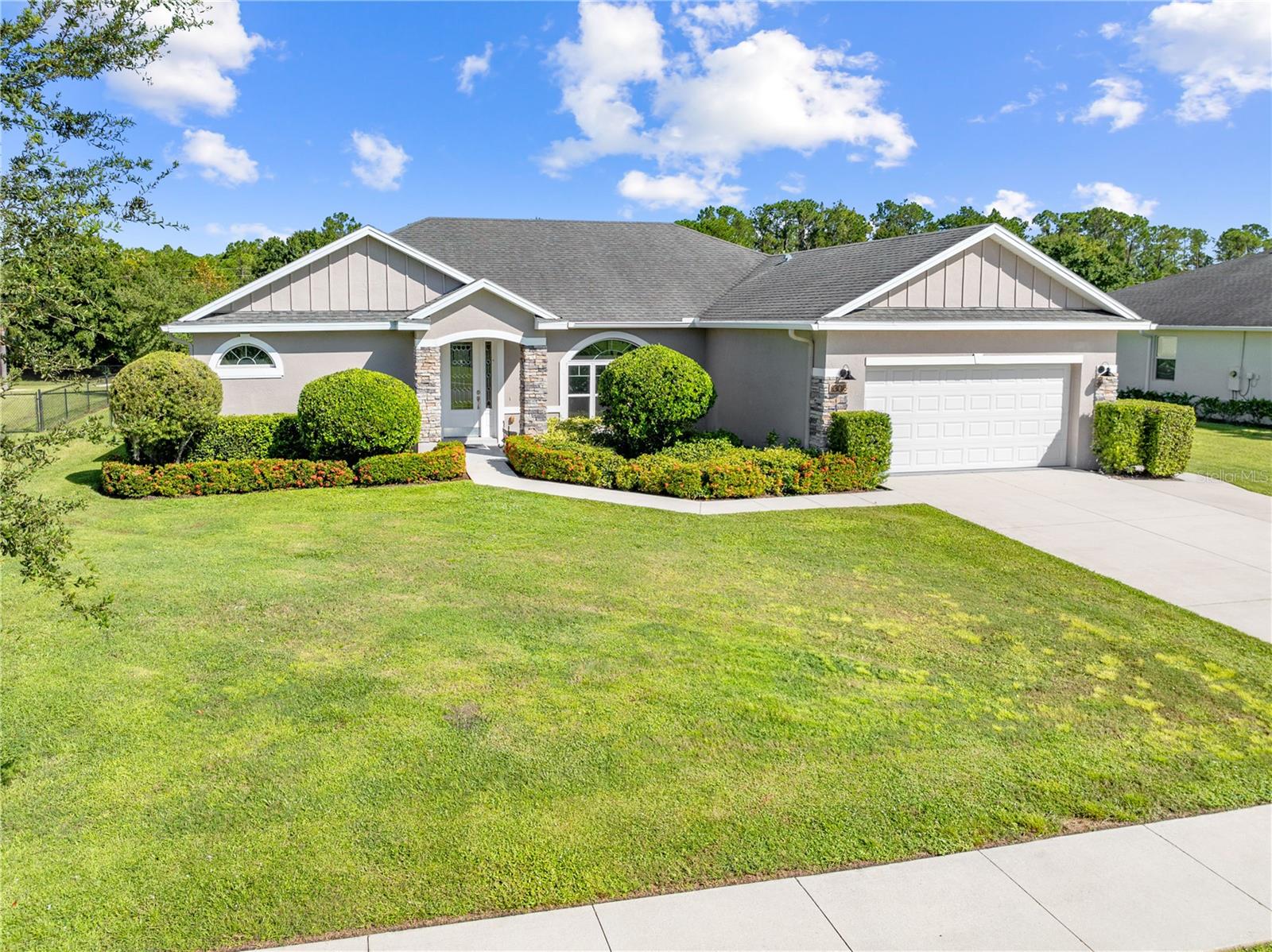 Pride of ownership prevails in this beautiful home located in the Nova Park community of St. Cloud. This single-story home offers a rare combination of space, privacy, convenience and a balance of indoor comfort and outdoor living. Built on nearly half an acre, the design includes both formal and casual living spaces, of course with the option to use the formal area as an office or an additional flex space depending on your needs. The kitchen serves as the centerpiece of the home, finished with solid wood cabinetry, granite countertops, a wide island with seating, and a double pantry for storage. It flows naturally into the family room, creating a comfortable space where daily routines and gatherings come together. A separate dining room and living room provide additional areas for hosting or relaxing. The primary suite is set apart for privacy and includes a walk-in closet along with a spacious bath featuring dual sinks and an oversized shower. Three additional bedrooms and a full bathroom are located on the opposite side of the home, making the layout practical for families or overnight guests. The laundry room includes a sink and plenty of storage to help keep things organized. Outdoor living is a highlight, with sliding doors that open to a covered back porch measuring more than twenty feet wide. The oversized pool with splash pad is a standout feature, perfect for entertaining and everyday enjoyment. With no rear neighbors, the yard feels private and offers plenty of room for future projects. A two-car garage, landscaped grounds, and sturdy block construction complete the home. Nova Park is a quiet neighborhood with low dues and access to a community gazebo overlooking nearby Coon Lake. Its location offers a peaceful setting while remaining close to schools, shopping, and commuter routes. Set your private showing appointment today!