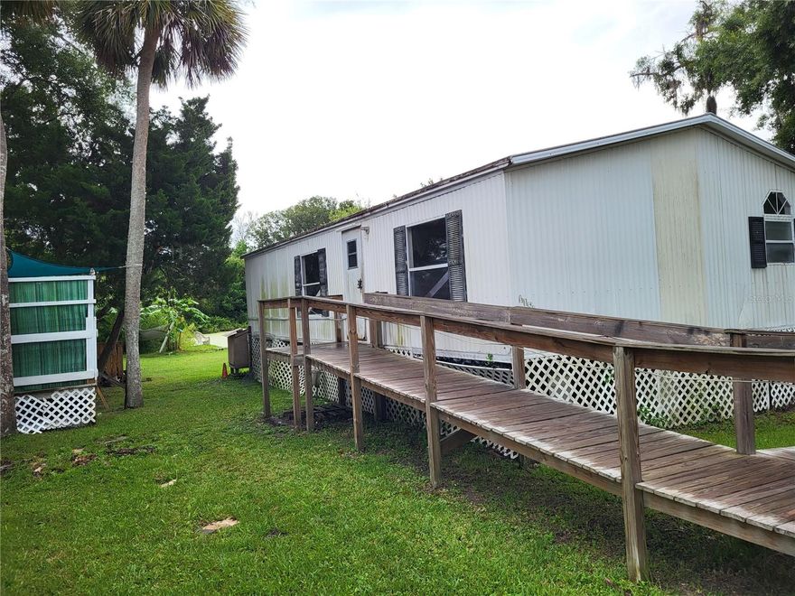 Roomy 2 bedroom, 2 bath double wide mobile home in great location near US 19 in Hudson for 1 year lease.  Being painted inside, available July 7-15.  Laminate flooring, new interior paint.  Vaulted ceilings, split bedroom plan, central HVAC.  Water and sewer, trash removal included in rent.  Pet considered on case by case basis for additional fee under 35 lbs.  First month's rent and security due at lease signing.  $50 application fee per adult over 18.