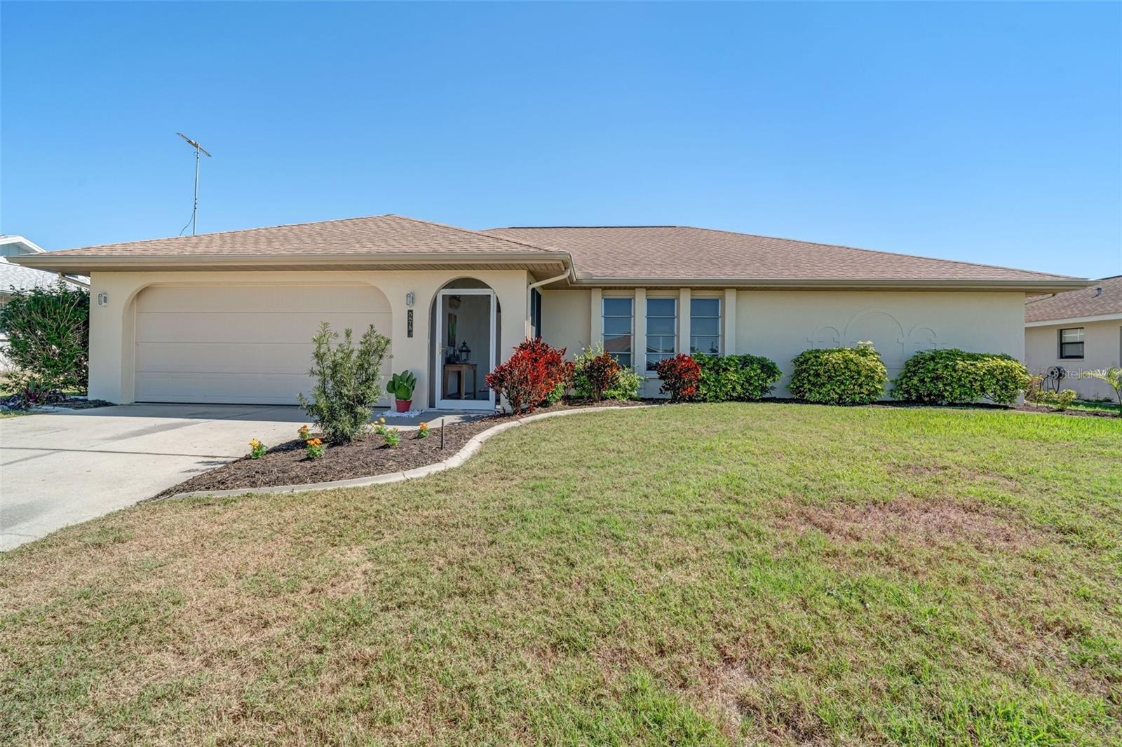 BEAUTIFUL HEATED POOL HOME - MINUTES FROM MANASOTA BEACH AND THE GULF OF MEXICO. This well maintained home features numerous updates, including a brand new water heater and garage door opener in 2025. The exterior was freshly painted in 2024 along with a total pool cage re-screen. Additional upgrades include a new roof and skylights, pool pump and the 200amp electrical panel with surge protector in 2019. Also, a new garage door and complete pool re-surface with Pebble Tec in 2018. The A/C system was replaced in 2017, ensuring year-round comfort and piece of mind. Inside with over 1800 square feet of living space, enjoy vaulted ceilings, an inside laundry room with ample storage and an open, spacious and inviting layout. Located minutes to the beach, this home offers the perfect coastal lifestyle with low HOA fees and no flood zone concerns. DON'T MISS THIS INCREDIBLE OPPORTUNITY !!!!!!!! VA ASSUMABLE MORTGAGE !!!