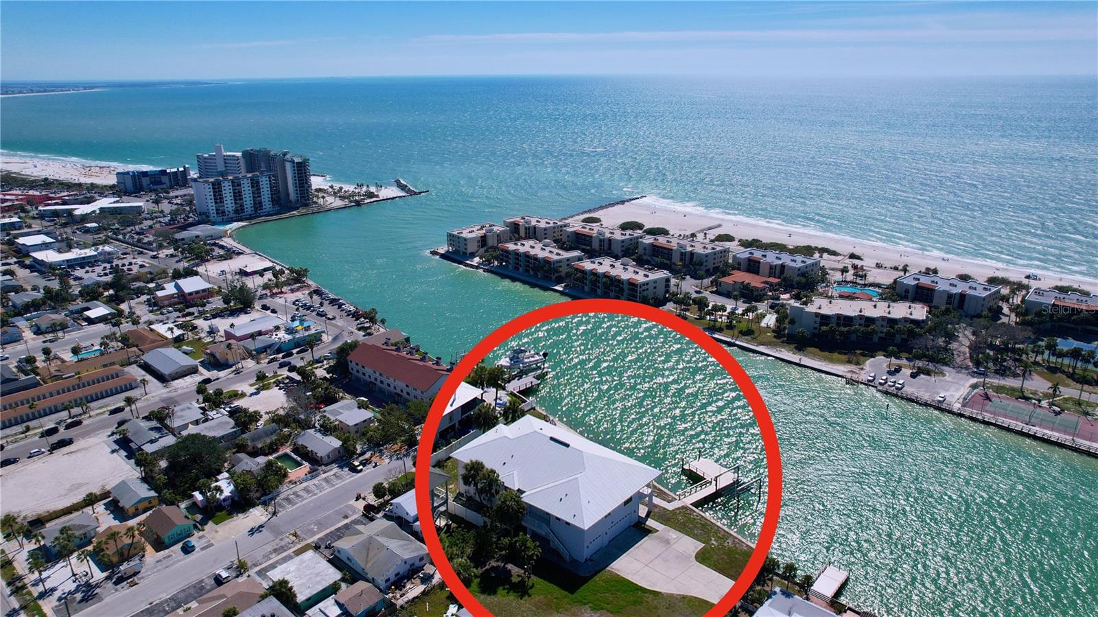 Beautifully renovated 4-bedroom, 3-bathroom waterfront home available for rent for a minimum of 3 months and up to 12 months. This home sits on 165 feet of Intracoastal frontage, offering stunning water views, a brand-new salt water pool and dock with a boat lift, and a perfect vantage point to watch boats coming in from the Gulf. Inside, the home features stylish stone shell tile flooring throughout and an open-concept layout with plenty of natural light. The kitchen offers ample cabinet space, a large island, and a practical design suited for everyday living. The primary suite includes private lanai access, a spacious ensuite bath, and a walk-in closet. Two additional bedrooms provide comfortable accommodations, while the fourth bedroom is currently set up as an office but can be used as a bedroom if needed. The lanai overlooks the water, creating a relaxing outdoor space to enjoy the Florida lifestyle. The property offers easy boating access, plenty of parking including space for an RV, boat, or trailer, and is just a short distance from Corey Avenue shopping, dining, and the beach. This home is mostly furnished, with enough space left to add your own pieces for a personal touch. Built 14 feet above sea level, the interior has never flooded. The extra large garage is fully functional, though drywall has not been replaced after water did enter last year.