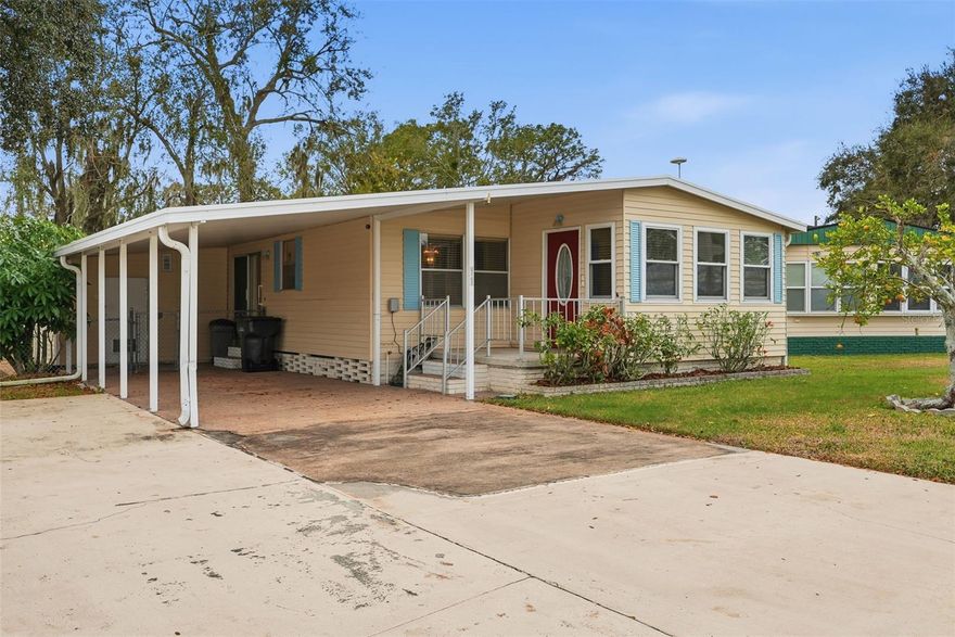 Welcome to 1610 Reynolds Road, Lot 11, a well-maintained double-wide home located in the 55+ Citrus Woods community. This 2-bedroom, 2-bath home offers a functional layout, with the second bedroom currently used as a home office, providing flexible living options.

The primary bedroom features sliding glass doors that open to a private back deck—an ideal space for outdoor lounging and everyday enjoyment overlooking a peaceful, secluded backyard. The large walk-in closet off the primary bathroom offers plenty of space for all of your needs. And the large indoor laundry is very convenient and offers additional storage. The home offers comfortable indoor living with convenient access to community amenities.

Citrus Woods residents enjoy a clubhouse, heated pool, shuffleboard courts, billiard room, library, and a variety of organized community activities. Additional information about the community is available on their website.