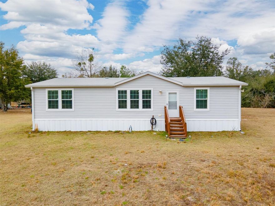 Escape to peaceful North Florida living with this 2021 3 bedroom, 2 bath modular home offering 1,612 square feet of comfortable, modern space on just under 10 private acres in Live Oak. 

Inside, you'll find a bright open-concept floor plan that seamlessly connects the living, dining, and kitchen areas — ideal for both everyday living and entertaining. The spacious primary suite features a private bath and generous closet space, while 2 additional bedrooms provide flexibility for family, guests, or a home office.

Step out back and unwind on the porch, the perfect spot to enjoy your morning coffee, watch the sunset, or take in the peaceful country surroundings. With nearly 10 acres, there's ample room for horses,  livestock, gardening, or simply enjoying the privacy and natural surroundings that make Suwannee County so desirable. A shed with power adds valuable versatility, perfect for a workshop, equipment storage, or hobby space.

If you’ve been searching for newer construction with acreage and country charm, this property delivers the best of Suwannee County living.
