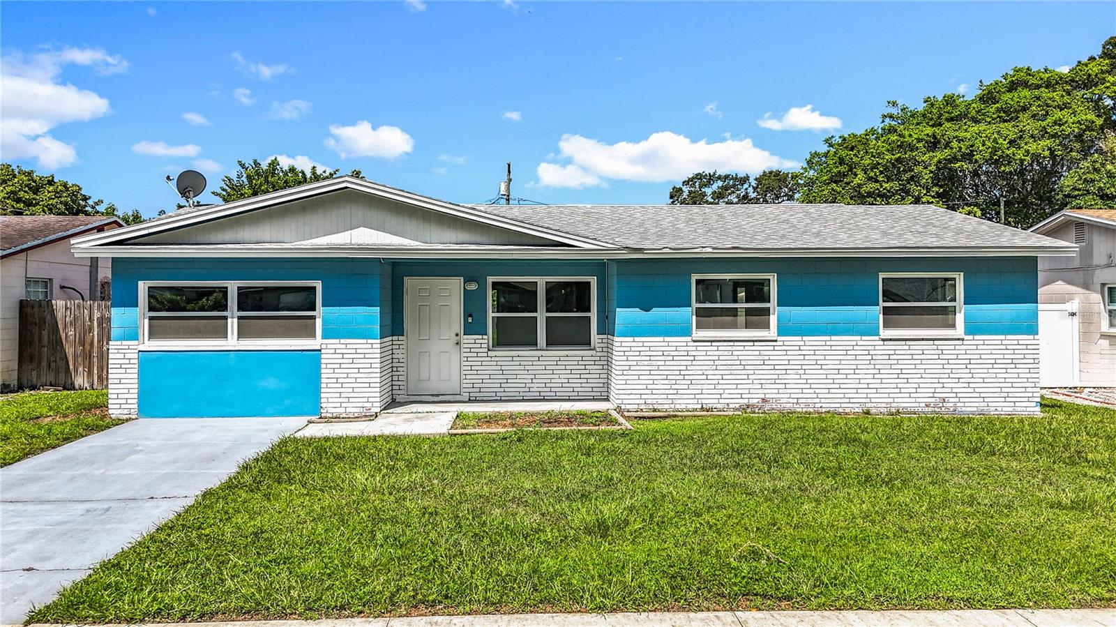 Welcome to your dream home at 4060 30th St N, St. Petersburg, FL 33714! This stunning, fully updated single-story 3-bedroom, 1-bathroom gem, renovated in 2022, offers modern comfort and timeless charm. Step inside to discover luxury vinyl plank (LVP) flooring throughout, complemented by a sleek, updated kitchen featuring white shaker cabinets, subway tile backsplash, granite countertops, and stainless steel appliances. The refreshed bathroom exudes elegance, while the cozy family room with a fireplace invites relaxation. A spacious inside laundry room adds convenience, and the expansive rear yard with a patio is perfect for outdoor entertaining. With a 2022 AC, 2022 water heater, 2022 electrical panel, 2022 windows, and a 2016 roof, this home offers peace of mind and energy efficiency. Located in vibrant St. Petersburg, you’re just minutes from an array of attractions within 20 miles: soak up the sun at St. Pete Beach (10 miles), explore the vibrant art scene at the Salvador Dalí Museum (6 miles), or enjoy family fun at Tropicana Field (5 miles). Downtown St. Petersburg’s bustling shops, restaurants, and waterfront are only 5 miles away, while Clearwater Beach (15 miles) and Busch Gardens Tampa Bay (18 miles) offer endless adventure. This move-in-ready home combines modern upgrades with an unbeatable location.