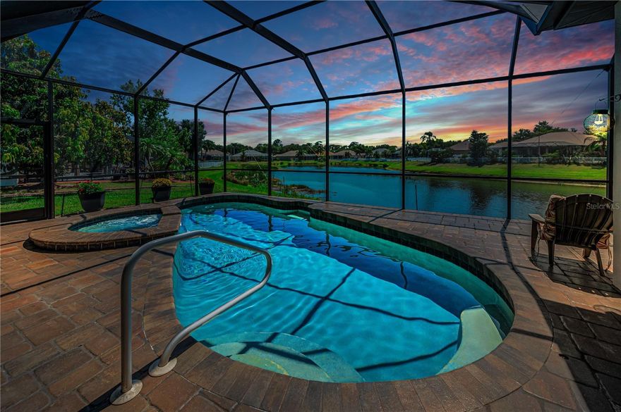 This isn’t just a house—it’s a lifestyle. Nestled in the highly sought-after River Woods community of Parrish, this 4-bedroom, 3-bathroom home with a 3-car garage offers the perfect blend of elegance and comfort. Step inside to soaring ceilings, neutral tile, and plantation shutters, with sliding glass pocket doors opening the living spaces to a lanai, heated spa pool, and glistening pond—creating seamless indoor-outdoor Florida living.

The gourmet kitchen features shaker cabinetry, granite countertops, and all-new stainless steel appliances. The split floor plan includes a luxurious master suite with dual sinks, garden soaking tub, curbless walk-in shower, private toilet room, and two spacious closets. The 4th bedroom, complete with ensuite bath and pool access, is ideal for guests or a mother-in-law suite, while two additional bedrooms share a full bath in another wing of the home.

Custom features include arched doorways, tile laid on the diagonal, luxury vinyl flooring, owned Electra solar panels, and a 2022 roof. Low HOA dues, no CDD fees, and access to River Woods amenities—including tennis and pickleball courts, clubhouse, community pool, gazebo, and a boardwalk over the Manatee River—complete this turnkey Florida lifestyle:

Minutes from local shops, dining, and cafes, with easy access to Ellenton, Bradenton, and Lakewood Ranch for outlets, waterfront restaurants, and world-class shopping.