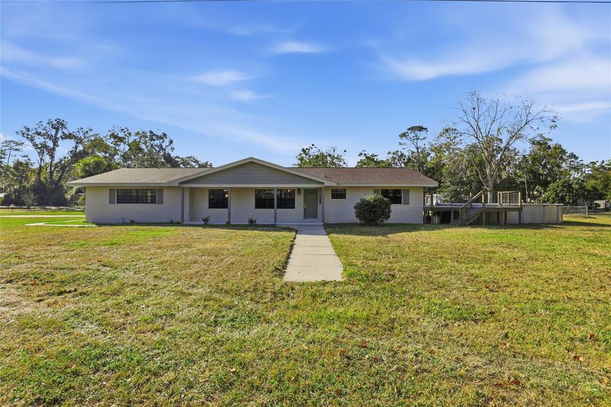 Spacious 3BR/2BA home on nearly 3/4 acre—entire city block—in the heart of Trenton! Solid concrete block & brick construction with a 2024 roof and 2025 HVAC. Interior offers large bedrooms, an open & functional layout, and a spacious kitchen with newer stainless appliances. Covered back lanai overlooks the fenced yard, above-ground pool, and wood deck—perfect for entertaining. Plenty of room for pets, gardening, or play. Includes 2-car garage & paved drive. Rare in-town privacy with quick access to top-rated Gilchrist County schools, the Suwannee River, and the Gulf Coast.