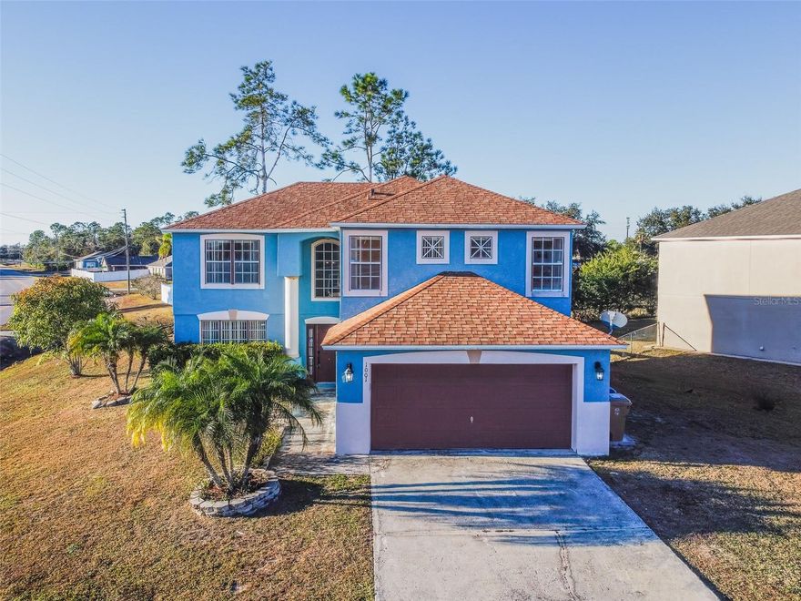 Welcome home to this beautifully maintained 5-bedroom, 3-bath residence in the highly sought-after Poinciana Village community. Designed for both comfort and functionality, this spacious home offers an open-concept layout that’s perfect for entertaining or enjoying everyday life. Natural light pours into the living areas, creating a bright, welcoming atmosphere throughout. The kitchen is thoughtfully appointed with ample cabinetry, modern appliances, and generous counter space, seamlessly flowing into the dining and living areas—ideal for staying connected while hosting family and friends. The primary suite provides a relaxing retreat, complete with a private en-suite bath and a large walk-in closet. Additional bedrooms are well-sized and versatile, offering endless possibilities for guests, a home office, or a growing household. Step outside to an oversized backyard framed by lush landscaping, offering both privacy and space to unwind, entertain, or soak up the Florida sunshine. Poinciana Village offers a true sense of community with resident events and amenities, and HOA fees conveniently include cable and internet. Centrally located with easy access to major highways, this home places you just minutes from Disney World, shopping, dining, fitness centers, banks, and top entertainment. This is an exceptional opportunity to own a beautiful home in one of Central Florida’s most desirable communities.