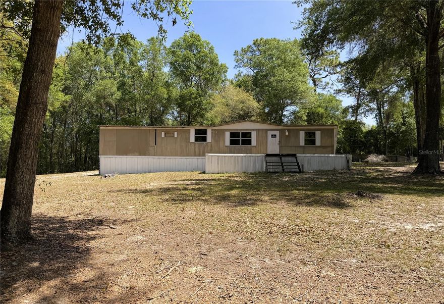 Looking for a project with personality? This oversized, cleared lot comes with a head start. An existing manufactured home sits on the property along with well, septic, and power already in place, giving you the rare chance to revive, rebuild, or reimagine something truly your own. It needs TLC, but that’s where the opportunity lives. Handyman special? Absolutely. Investor alert? Even better.
A gated driveway leads you onto the property, and if you’re dreaming bigger, two adjoining parcels are also available, opening the door to expanded space, multi-lot ownership, or future development potential.
All of this sits in the heart of the Keystone Heights lifestyle — surrounded by spring fed lakes, public boat ramps, top-rated schools, community parks, and miles of scenic trails. Whether you’re into fishing, paddling, hiking, or simply enjoying the charm of a small lake town, this location delivers the vibe.
Buyer to verify condition of existing well and septic; seller makes no guarantees.
Bring your imagination, your toolbox, and your sense of adventure — this one has the potential to become something special.