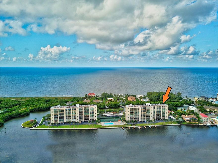 WATERFRONT. PENTHOUSE. AMAZING VIEWS!  ***Enjoy unobstructed breathtaking WATER & NATURE VIEWS of the Gulf of Mexico, Little Sarasota Bay and the Jim Neville Preserve from this prominent top floor 2B/2B condominium located on sought-after Siesta Key at The Pointe. ** The open reconfigured space allows plenty of room for entertaining guests or simply relaxing while you watch the spectacular views of the sunrise over the bay and sunset over the gulf. This partially furnished and freshly painted PENTHOUSE with waterfront views from every room features a master bedroom with ensuite bathroom, open kitchen with granite countertops (2018), tiled floor, laundry in unit off lanai with new washer (2022), 75" Sony TV (2021), convenient coveted UNDER BUILDING parking (deeded), new A/C (2022), and a spacious 30’ lanai with full-width sliding glass doors, allowing peaceful and secluded open-air viewing of the beautiful bay and uninhabited nature preserve. 
*** THE POINTE is a PET-FRIENDLY gated community offering the best of both worlds: activity and exercise, plus peace and tranquility. The property encompasses 5+ acres and features: Boat docks w/electricity and water. Kayak/canoe/SUP launches. Heated outdoor lap pool at waterside. Spa. Sauna. Tennis and pickleball courts. Dog walk. Outdoor, fresh-air walkways to each unit. Butterfly garden. Open-air gazebo w/BBQ grills. Club house. Separate entertainment/party rooms. A fitness center in each building. And, more!  Surrounded by water on three sides, THE POINTE has easy access for boating and kayaking.  ADVANTAGEOUSLY LOCATED: you will find fine and casual dining (nearby), Turtle Beach, shopping, coffee shops, nightlife, entertainment, a full-service marina, a campground on the beach, Siesta Key beach, public transportation and much more - all on Siesta Key.  ***A rare find and unique chance to own a piece of paradise! *** Live the ISLAND LIFE!