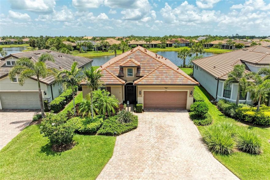 Welcome to this beautifully appointed home located in the sought-after 55+ gated community of Del Webb Lakewood Ranch. Situated on a premium waterfront lot, this 2-bedroom, 2-bath home with a flexible office/den offers the perfect blend of comfort, style, and tranquility.

Step inside to find an open-concept layout with tile flooring, high ceilings, and abundant natural light. The gourmet kitchen features quartz countertops, stainless steel appliances, modern cabinetry, and a spacious island that flows seamlessly into the living and dining areas—ideal for both everyday living and entertaining.

The owner’s suite boasts serene water views, a large walk-in closet, and an en-suite bath with dual sinks and a walk-in shower. A private guest bedroom and full bath provide comfort for family or visitors. The versatile den/office offers the flexibility to work from home or host overnight guests.

Step outside to your screened lanai overlooking the lake, where you can enjoy morning coffee or evening sunsets in peaceful privacy.

Enjoy world-class amenities including a resort-style pool, fitness center, tennis and pickleball courts, clubhouse, and planned social activities—all just a short golf cart ride away.

Don't miss this opportunity to live in one of Lakewood Ranch's premier active adult communities. Schedule your private showing today!