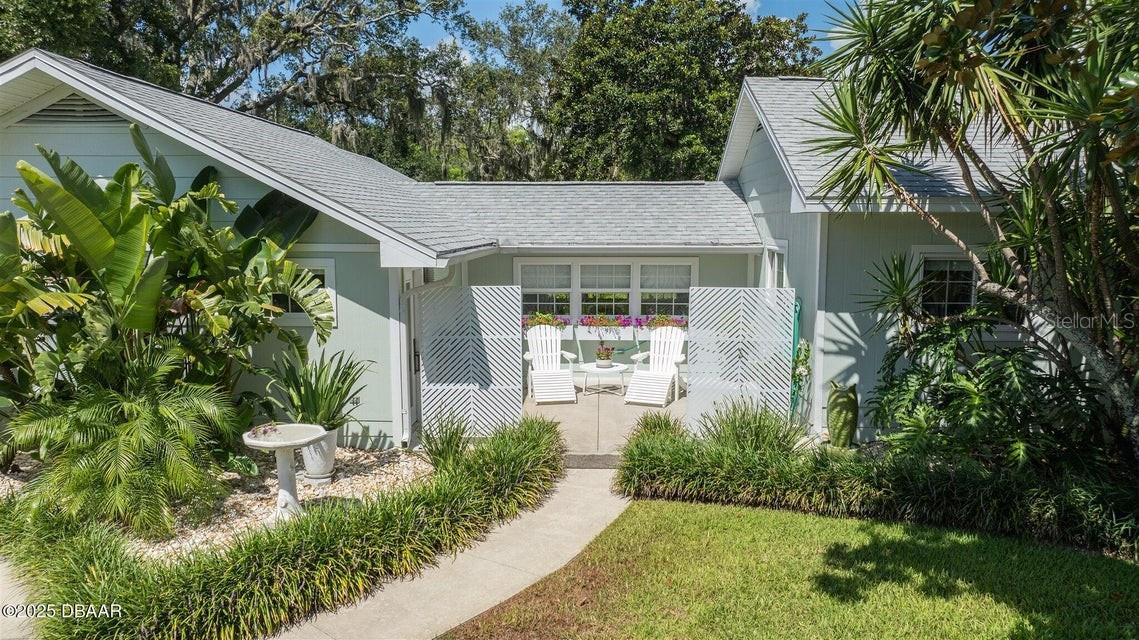 Priced at Current Appraised Value this stunning home in a quiet Old FL Neighborhood is a must see. Constructed in 1927 with extensive remodeling and additions is in excellent condition for its age with above average quality of construction. Some of the many various improvements and upgrades include, but are not limited to: new roof 11/2023, new HVAC 2024, siding, vinyl windows, doors, large screen porch, interior/exterior painting, landscaping, fencing/gate, irrigation system, flooring, wood cabinets, quartz countertops, appliances, mill work (trim), plumbing & plumbing fixtures, electrical fixtures boxes & wiring, built-ins, carport, ceiling fans, deck off master suite wired for a hot tub, outdoor shower, 7' tub w/tv in master, endless closets & storage, 337' screen room, shed (with French doors, window & small deck) & more. A five minute drive to the beach and just steps from the Halifax River, this move in ready, totally fenced/gated home will not disappoint with it's private backyard paradise!