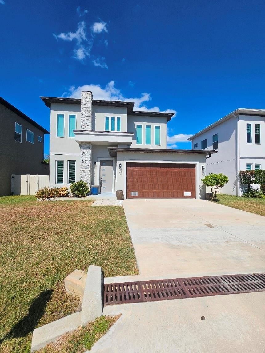 Welcome home to this freshly painted, beautifully maintained, modern 4 bedroom, 2.5 bath home with a 2 car garage in South Tampa built in 2019! As you enter, you enter into the formal dining room. This home features porcelain flooring as well as master suite with spacious master bathroom with a frameless glass shower and soaking tub and closet on the a first floor! The kitchen boasts quartz counter tops with stainless steel appliances, European cabinetry and a breakfast bar in the island. You can relax in the living room without having to close the blinds as there are NO backyard neighbors and the yard is completely fenced with privacy, vinyl fencing. There is a half bath and laundry room on the first floor as well. Upstairs you will find 3 more spacious bedrooms with luxury vinyl plank flooring and a bathroom with porcelain flooring. The bathroom also has quartz counter tops and glass shower.  There are so many high end, modern finishes in this home, it's amazing! Location of this home is also perfect! So close to MacDill AFB, major shopping, restaurants & highways. Basic lawn care is included. Applicants must have a credit score of 600 or better and must make 3x the rent in Net Income. All adults must apply separately. Pets must be approved prior to applying. Rent, Non-refundable Pet Fee (if applicable) and Administrative Fee of $125 are due on the day of move in.