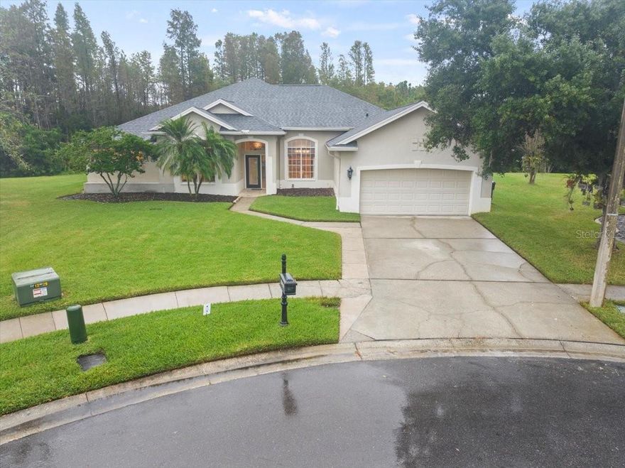 We are proud to present this enchanting home in Calusa Trace with 2700+sq ft, 4 bedrooms, 3 bathrooms and sparkling pool with spa tucked away on a quiet cut-de-sac.  This home exudes elegance.  Travertine floors in most rooms, high ceilings, and crown/custom molding in all of the rooms and doorways.  This meticulously designed home offers a master suite with double entry doors, vaulted ceiling, sliding glass doors with pool and conservation views, dual closets with floor to ceiling storage, and a beautiful Master Bath with custom cabinets, dual sinks, garden soaking tub and walk in shower.  2 guest bedrooms on the other side of the home feature crown molding and share a guest bath with shower/tub combo.  The Kitchen is a chef's delight with an abundance of cabinets and countertops, 2 pantries, breakfast bar, separate dinette and opens to the Family Room.  The Family Room has gorgeous built in cabinets and wine refrigerator, with granite backsplash.  The 4th bedroom is located at the back of the home and accesses a 3rd bathroom with walk in shower and access to the pool.  The backyard features a beautiful pool with spa and waterfall features, sun shelf, vaulted pool cage with custom lighting and conservation/pond views beyond.  This home has been meticulously maintained and it shows. Too many features to list.  Great location near shopping, dining and highways, Steinbrenner schools!  New Roof in July 2023!