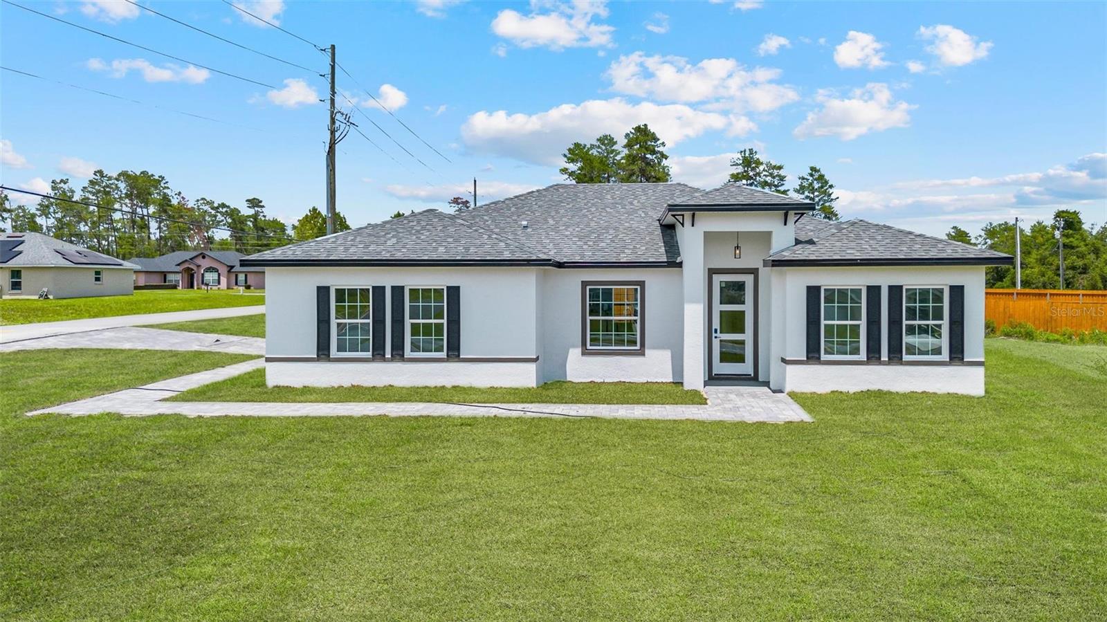Beautiful home for rent in Ocala, Florida! This charming four-bedroom home combines comfort, elegance, and practicality all in one. Upon entering, you'll be greeted by a spacious and cozy living room, ideal for relaxing or entertaining in style. The kitchen is a highlight—perfect for those who love to cook—equipped with modern stainless steel appliances, spacious cabinets, sophisticated stone countertops, and contemporary details that combine beauty and functionality. The master suite serves as a true retreat, with a spacious walk-in closet and a luxurious bathroom designed for maximum comfort. The other three bedrooms are equally spacious, with built-in closets, perfect for accommodating your family. Outside, the well-kept front garden and charming balcony provide a pleasant space to enjoy a coffee al fresco or relax at the end of the day. The two-car garage offers practicality and extra storage space. Located in a great area of Ocala, this home combines style, functionality, and comfort. Don't miss this opportunity—schedule a viewing and come see for yourself!