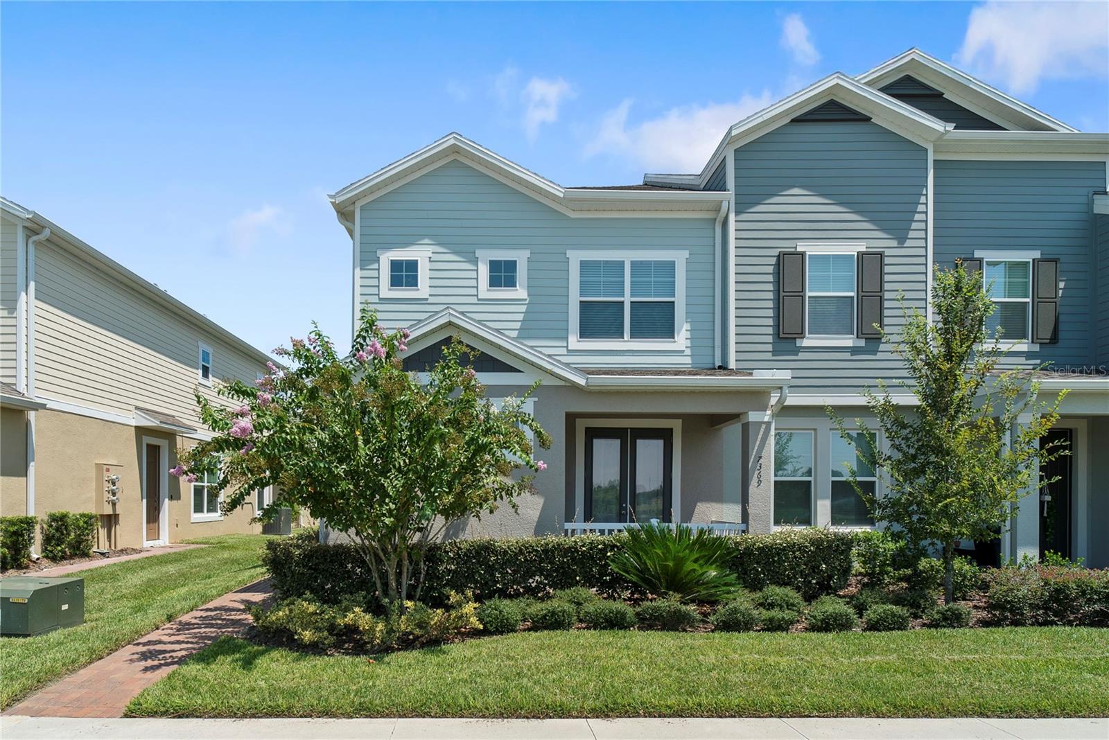 An exceptional opportunity has arrived—welcome to this beautifully designed 4-bedroom, 4-bath corner townhome, one of the very first resales in this fully sold-out community. With the builder now closed out, chances like this are few and far between. Perfectly blending convenience, charm, and modern design, this residence captures everything today’s buyer is looking for.From the street, the end-unit location immediately sets the home apart. The additional windows bring in streams of natural light throughout both levels, creating a warm and cheerful atmosphere inside. The added side yard provides a touch of privacy and green space that most townhomes don’t offer, making it ideal for gardening, pets, or simply extra room to spread out.Step inside and discover a two-story layout crafted with flexibility in mind. The primary suite is thoughtfully located on the first floor, providing easy access and a retreat-like feel. The en-suite bath includes dual vanities, a generous walk-in shower, and the finishes you’d expect in a home that still feels brand new. Upstairs, additional bedrooms are perfectly arranged to accommodate family, visiting guests, or even a work-from-home setup.This unit also shines with tasteful custom accent walls that add a sense of character and depth to the living spaces. These upgrades bring personality and a designer’s touch, ensuring your home feels unique without the wait or effort of doing it yourself. The open-concept kitchen and living area tie everything together, with plenty of room to cook, dine, and relax—all while enjoying a seamless connection to your outdoor living space.Just beyond the back door, you’ll find a detached garage paired with a charming private patio. It’s a wonderful extension of the living area and the perfect spot for morning coffee, weekend barbecues, or quiet evenings under the stars. And of course, the true showstopper remains the uninterrupted golf course views. Few townhomes in the neighborhood enjoy this outlook, making this property a rare gem where the scenery is as much a part of daily life as the home itself.Living here also means embracing a lifestyle of ease. Exterior maintenance is handled for you, leaving more time to enjoy the things you love. Whether that’s nearby shopping, dining, or recreation—or simply relaxing and watching the sun set over the fairways—you’ll quickly find this community fits your lifestyle beautifully.With limited opportunities and the builder completely sold out, this resale offers the best of both worlds: the comfort of a nearly new home paired with the convenience of move-in readiness. If you’ve been searching for a townhome that combines functionality, beauty, and rare golf course views, this is the one. Schedule your tour today and see how this home stands apart in a neighborhood that everyone is talking about.