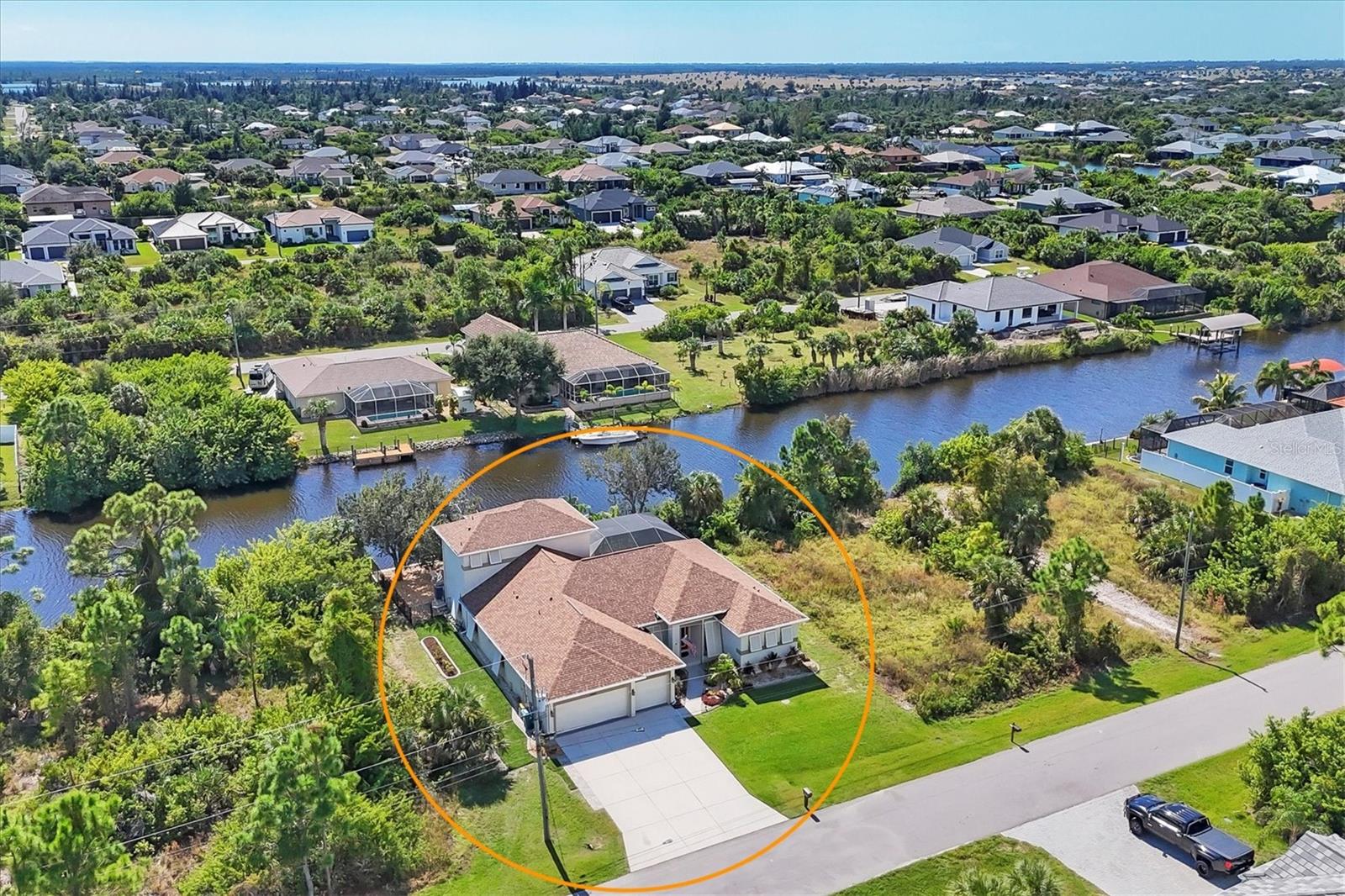 Welcome to 15392 Aldama Circle, Port Charlotte, FL 33981 — a boater’s paradise offering the perfect combination of luxury, comfort, and GULF-ACCESS living! This 5-bedroom, 4-bath HEATED POOL home with a den/office features one of the most sought-after floor plans, offering open-concept living while still providing space and privacy for family and guests. With TWO PRIMARY SUITES—one on the main floor and one upstairs—the possibilities are endless for multi-generational living, guests, or in-laws.
From the moment you step inside, you’re greeted by tall ceilings, elegant wood-look porcelain tile flooring, and breathtaking water views that draw you straight to the lanai. The spacious kitchen is truly the heart of the home, featuring abundant cabinetry, a large center island with granite countertops, stainless steel appliances, and a walk-in pantry. Enjoy meals in the sunlit eat-in kitchen or take them outdoors through sliding glass doors that open to the screened lanai. The first-floor primary suite offers sliding glass doors to the pool area, dual walk-in closets, and a spa-like en-suite bathroom with dual vanities, a soaking tub, and a walk-in shower. Upstairs, a second primary suite provides stunning waterfront views and can easily serve as a guest suite or private retreat with its own en-suite bath.
Step outside and enjoy your heated pool and lanai overlooking the canal, or spend the day on the water with your 10,000 lb. boat lift and 80-ft. concrete seawall (installed in 2018). The property is fully fenced, includes hurricane shutters, and is part of the friendly South Gulf Cove community with a voluntary HOA—no strict regulations on parking your toys, boats, or RVs in the driveway. Find comfort knowing this home features a Newer Roof (2022) and AC (2023) for added peace of mind. This home is just a short drive from the pristine crystal blue water and sandy beaches of Boca Grande, Manasota Key, and Venice, this home offers the very best of Florida’s coastal lifestyle.
Leave the snow behind and experience true paradise — schedule your private showing today and make 15392 Aldama Circle your new waterfront retreat!