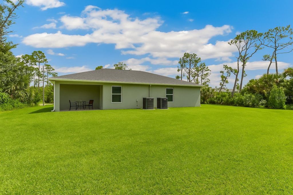 Photo of 12007 Henley Avenue, Port Charlotte, FL 33981 (MLS # TB8418793)