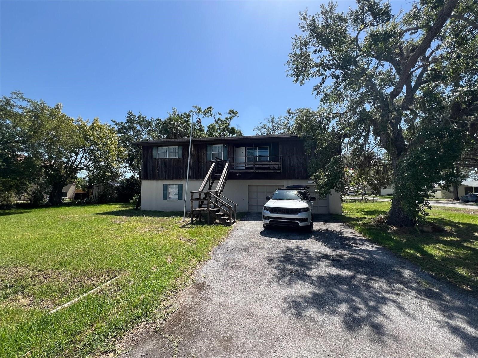 ***front staircase is broken use at your own full risk & liability. Please use back staircase to access the property. Unlock the potential in this solid 3 bedroom, 2 bathroom block home located in desirable Ellenton, Florida. With 1,352 square feet of living space, a two-car garage, and a great floor plan, this property is a prime candidate for a full renovation. Sold AS IS, The home has been well maintained structurally, giving you a head start—just bring your design vision! Priced right to leave plenty of margin for updates and resale.