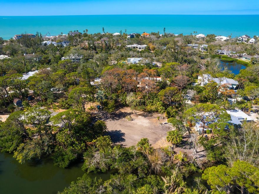 Build Your Dream Home in the prestigious Sanderling Club on Siesta Key. This is your rare opportunity to create a custom estate in one of Sarasota’s most sought-after gated communities, where Old Florida charm meets refined elegance. The spectacular .53-acre property is nestled on a private canopied lane. With 152 feet of private waterfront along serene Heron Lagoon, your backyard becomes a personal retreat—ideal for kayaking, paddleboarding, canoeing, and fishing in tranquil waters. The community’s private Gulf-front beach invites you to savor breathtaking sunsets, while an exclusive harbor front marina provides direct sailboat access to Sarasota Bay, the Intracoastal Waterway, and the Gulf of Mexico—a true boater’s paradise. Sanderling Club residents enjoy a vibrant social scene, with exclusive events and amenities designed for luxury living. Just minutes away, indulge in the world-renowned quartz sands of Siesta Key Beach, fine dining, and boutique shopping in Siesta Village. Meanwhile, downtown Sarasota’s theaters, opera, ballet, art galleries, and museums offer a rich cultural experience a short drive away. This rare homesite is an unparalleled canvas to bring your architectural vision to life in a setting defined by privacy, exclusivity, and coastal beauty. Seize this opportunity to build your dream Siesta Key estate.