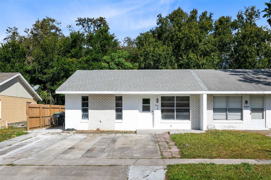 One or more photo(s) has been virtually staged. Amazing opportunity to live in the Heart of Orlando! Walking distance to grocery and restaurants and just 15 minutes from Downtown Orlando. You'll love all of the natural light that pours into the living room as you step inside. Brand new laminate floors throughout the main spaces and kitchen then brand new carpet offers comfort in the bedrooms. This 1/2 duplex features 2 bedrooms and 2 full bathrooms that have been completely updated from top to bottom. Beautiful new vanities and tile throughout with walk-in showers. In the kitchen you'll love the brand new stainless steel appliances and updated cabinets and counter tops plus access to your indoor laundry room. All the majors have been taken care of for you so all you need to do is move right in and make this house your home! Brand New Roof October 2023, New A/C 2023, Brand New Stainless Appliances 2023, Water Heater 2020.