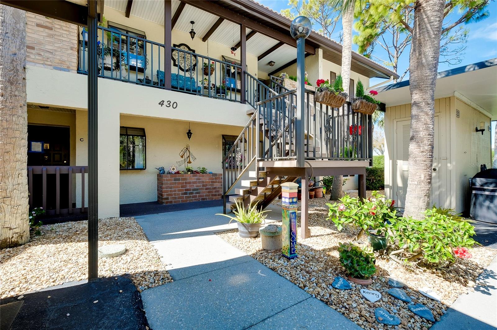 RARELY AVAILABLE UNIT WITH ENCLOSED LANAI FOR ADDED AIR-CONDITIONED SPACE! This charming 2-bedroom, 2-bathroom 1,155 sq. ft. condo is nestled in the desirable Mission Lakes community, offering a peaceful and relaxed lifestyle just minutes from the beach and Venice Island. As you enter, you will be greeted by an OPEN AND AIRY living space that extends all the way through the home and out on to your light and bright ENCLOSED LANAI, which is perfect for entertaining or unwinding after a day in the sun. The kitchen features NEWER CABINETS, GRANITE countertops and ample counter space, making meal preparation a breeze. The spacious master bedroom boasts a WALK-IN closet and en-suite bathroom, providing a comfortable oasis to relax and rejuvenate and a door to the enclosed lanai. A unique feature of this condo is there is a handy DROP-DOWN LADDER in the primary closet that allows ACCESS TO THE ATTIC and ample storage space. A stylish BARN DOOR has been added to the hallway to the second bedroom and bathroom, creating a GUEST SUITE FEEL that your family and friends will be sure to enjoy while visiting. The second bedroom is perfect for guests or can be used as a home office or den. The lanai was opened up to add square footage and is the perfect place to enjoy your morning coffee or evening cocktail while taking in the serene LAKE VIEWS. Few units in this community have this feature. The community amenities include THREE HEATED POOLS for your enjoyment. And your car will always have a shady place to be parked, featuring an open-air carport with a convenient attached STORAGE ROOM. The current owners have made over $28,000 in UPGRADES since taking ownership. including REPLACE all the old DOORS, replaced the WASHER AND DRYER, added a DRY BAR with QUARTZ COUNTERTOPS in the living space, NEW HVAC and THERMOSTAT in 2019, PRIMARY BATHROOM REMODEL, GLASS SHOWER DOORS in the guest bathroom and many other great improvements. With its prime location just a short drive from Venice Beach, historic downtown Venice, the YMCA, and a variety of shopping and dining options, this condo is the perfect place to call home. Don't miss out on this opportunity to live the Florida lifestyle you've always dreamed of!