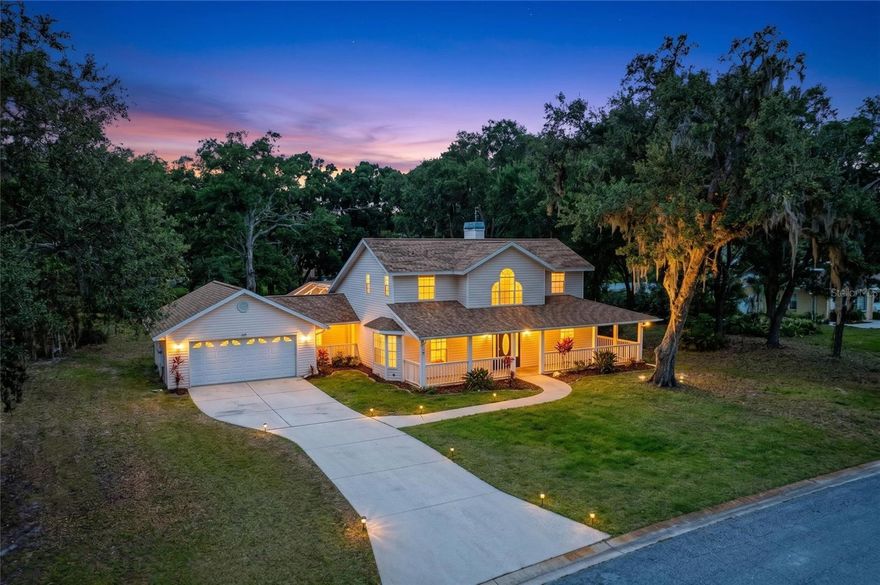 One or more photo(s) has been virtually staged. Delightfully charming country-style home accented by a lovely Palladian window and wrap-around front porch offering endless possibilities for enjoyment and relaxation. Beautifully updated kitchen reflects exceptional style and functionality. Formal dining room convenient to the kitchen, and private office with bay windows add to the attractiveness of the home. French doors in the living room lead to the lanai’s beautiful PebbleTec pool and paver deck. Stunning stone accents surround the fireplace in the living room adding to the elegance of the home.  The spacious downstairs primary suite boasts French doors leading to the impressive back yard shaded by gracious mature Oak trees.  The remodeled primary bathroom features a large walk-in shower, beautiful luxury tile, new vanity with dual sinks, luxurious ceramic flooring, and all new fixtures. Convenient covered breezeway connects the home with the oversized garage that offers ample storage space.  Low HOA fees and no CDD fees.  Access to community boat ramp and boat launch. Dock is equipped with water and electric giving residents access to the Manatee River. 
Buyer to verify square footage.