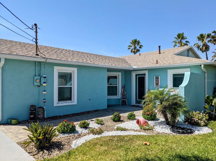 Welcome to this beautiful beach oasis offering a 2/2 with an open floorplan, one car garage and literally just Steps from the Beach.  
Beautifully landscaped property with large fenced in yard that sits on A1A with direct access to the beautiful Atlantic Ocean.  This charming 1/2 of duplex was built in 1998 and was fully renovated in 2019... including all impact windows, doors and overhead garage door which is also rust proof!! The entire home has beautiful Luxury Vinyl Tile flooring, new kitchen with Quartz counters and upgraded Whirlpool appliances. Both baths have also been completely remodeled and updated. This home is spotless and in move-in condition with all furnishings available for the new owner to make this their beachside paradise or a perfect investment property if you choose to long term/short term lease.  Master boasts a king bed, and the second bedroom is very spacious with a trundle bed.  Plenty of closet and storage space available inside and out and also in the garage which has attic space. Very large covered rear patio with pavers and fire pit where you can enjoy your expansive back yard with beautiful, tropical foliage with small shed.  With no HOA fees, this is a very desirable property and Buyer's agents are welcome!