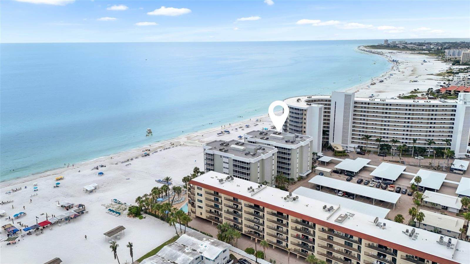 Welcome to 6310 Midnight Pass Rd #405N, an exceptional opportunity to own a turnkey furnished, income-producing beach retreat in the highly sought-after Crescent Arms community on Siesta Key. This rarely available 2-bedroom, 2-bathroom condo offers partial Gulf views from the spacious screened lanai and is just steps from private deeded beach access to Siesta Beach—ranked the #1 beach in the USA for its powdery white sand and crystal-clear waters. This residence is thoughtfully designed for effortless coastal living, featuring an open layout with a welcoming living and dining area filled with natural light. Whether you're searching for a personal getaway, seasonal retreat, or a smart investment, this residence offers the best of all worlds. With a strong rental history driven by its 1 week minimum rental policy, this condo offers excellent income potential. Even better, Crescent Arms offers on-site property management, allowing you to enjoy the unit when you want it and rent it seamlessly when you're away, truly a hands off investment opportunity on one of the most desirable beaches in the world. Crescent Arms is a gated beach front community offering resort-style amenities including a heated pool, clubhouse, private beach access, WiFi and cable, beach chairs, and secure building access. The dedicated on-site management and maintenance teams provide owners peace of mind and consistent rental support. Ideally located in the heart of Siesta Key, you’re just a short walk or bike ride from Siesta Village, restaurants, shopping, fishing charters, and all the local charm the island has to offer. With easy access to the mainland, downtown Sarasota’s vibrant arts, dining, and cultural scenes are just minutes away. Live on the #1 beach in the USA while your investment works for you. This is Siesta Key living at its finest.