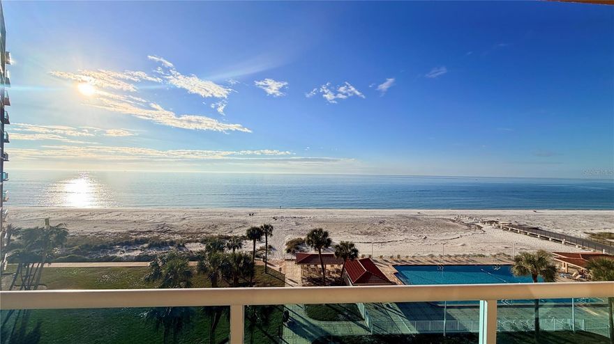 PRIME OPPORTUNITY!  This immaculate, renovated OCEANFRONT condominium showcases one of the most desirable floor plans in the building, highlighted by a rare double-balcony layout. The primary bedroom offers direct access to a private balcony, allowing you to awaken each morning to a serene, peaceful ocean view, while the living area opens to breathtaking panoramic vistas that enhance the connection between the interior spaces and the outdoors. What truly sets this condo apart are the custom faux-finish walls and carefully crafted ceiling features that add character and continuity throughout the unit, extending even the front entry. These artistic touches complement the flooring and create a cohesive, elegant look that feels both welcoming and well designed. The open concept kitchen includes granite countertops and coordinated cabinet color palette that blends seamlessly with the rest of the condo. The layout is ideal for everyday living and entertaining, offering comfort, functionality, and convenience. Additional, closet space provides practical storage. The bathroom is well appointed, featuring granite countertops and a spacious shower with beautiful tile throughout. Abundant natural light fills the condo, made possible by its excellent exposure and scenic views, creating a bright and comfortable living environment. Residents of Regatta Beach Club enjoy a full range of resort-style amenities, including a fitness center, clubhouse with separate kitchen, media and game rooms, shuffleboard courts, workshop, car wash station, EV charging stations , kayak and bicycle storage, and a Olympic-size heated swimming pool for year-round use. The gated community offers added security and peace of mind. Ideally located in North Clearwater Beach, this property is walking distance to restaurants, boutiques, shops, and the lively events at Pier 60, including entertainment and seasonal festivals. Just steps away to the North, Caladesi State Park provides a quiet coastal retreater for nature lovers. This condominium offers a unique combination of quality, location, and lifestyle, making it an excellent opportunity to enjoy comfortable beachfront living with resort-style conveniences. Whether as a primary home, second residence, or investment opportunity, this offering deliver exceptional value and the chance to experience some of Florida's most spectacular sunsets right from your own oceanfront residence.