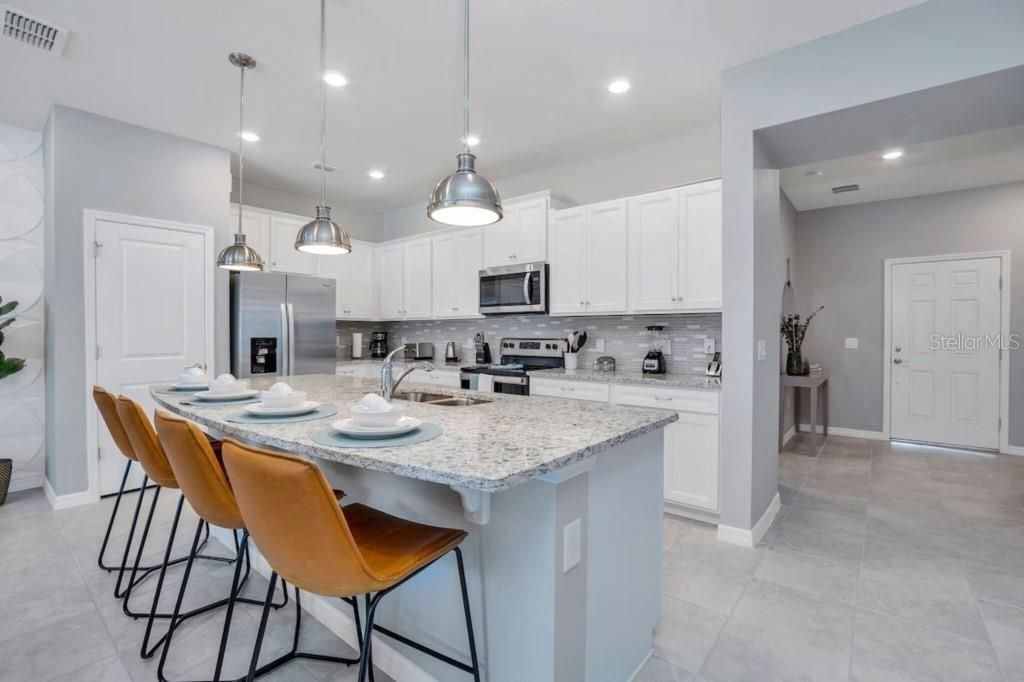 Photo of 1360 Lava Tree Drive, Davenport, FL 33897 (MLS # O6358934)