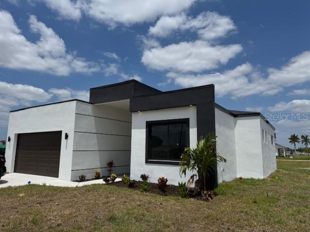 Photo of 101 NW 10th Terrace, Cape Coral, FL 33993 (MLS # C7509917)