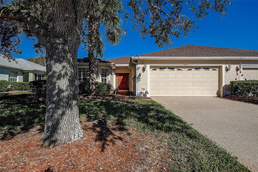 GUARD GATED COMMUNITY. Retire in Luxury at active RESORT-STYLE 55+ TAMPA BAY GOLF & COUNTRY CLUB! Move-in ready, maintenance-free Villa. Step inside to an OPEN CONCEPT floor plan with VAULTED CEILING! Enjoy Italian marble-looking ceramic tile, UNIFORM FLOORING THROUGHOUT THE HOME, perfect for both entertaining and everyday living! The large kitchen features wood cabinets, pantry, eat-in area, and NEW APPLIANCES 2023! This 3 bedroom SPLIT PLAN offers privacy for all. Retreat to your Owner’s Suite with sliders to the large screened lanai, step outside for a late night dip in your like new spa/hot tub! Enjoy the ensuite bathroom with dual sinks and huge 11X6 WALK-IN CLOSET! The 2nd and 3rd bedrooms are on the opposite side of the home for privacy. Inside laundry room for added convenience. Recent updates include NEW ROOF 2023, NEW APPLIANCES 2023, NEW WATER HEATER 2023, and NEW EXTERIOR PAINT 2022. NO FLOOD ZONE. TAMPA BAY GOLF & COUNTRY CLUB is an outstanding place to call home. Offering a TREMENDOUS RETIREMENT EXPERIENCE with access to a vast wealth of amenities and activities. Perfect Vacation home to lock and leave. We are a PET FRIENDLY community with 2 fully fenced dog parks. You’ll find 3 COMMUNITY BUILDINGS. 1. ACTIVITY CENTER features a state-of-the-art Fitness Center with all new treadmills, stationary bikes, row machine, and a variety of weights and machines, a cardroom, 2 Billiards tables with leather pockets, and a Conference Room. 2. COMMUNITY CENTER is a Hub of Social Activity, offering fitness classes, daily card games, a craft room with many classes for those with a creative side, a small auditorium for parties and special interest groups, a tennis court, pickleball court, bocce court. Corn hole courts and shuffleboard courts, and a smaller pool. 3. CLUB HOUSE features an elegant ballroom with a stage for live entertainment, Champions Bar & Grill, a sports bar, card and game rooms, library and resort's style pool CLOSE TO EVERYTHING in the Fantastic San Antonio/Wesley Chapel Area. Convenient to the Shops at Wiregrass, The Tampa Premium Outlets, The Grove at Wesley Chapel with the NEW KRATE Dining, Shopping & Outdoor Entertainment Venue. The Largest Ice Rink in the Southern US, The First Outdoor Snow Park Snow Cat Ridge open during the winter with Ice Skating, Tubing, Dining & Entertainment in the Igloo Village. Access to the Best Healthcare w/Multiple Advent Health's, Florida Medical Clinic's, Moffitt Cancer Center, The VA Hospital & USF Health. Enjoy Busch Gardens, downtown Tampa, Orlando, & the MOST BEAUTIFUL BEACHES IN FLORIDA! Schedule your private showing today! WELCOME HOME!