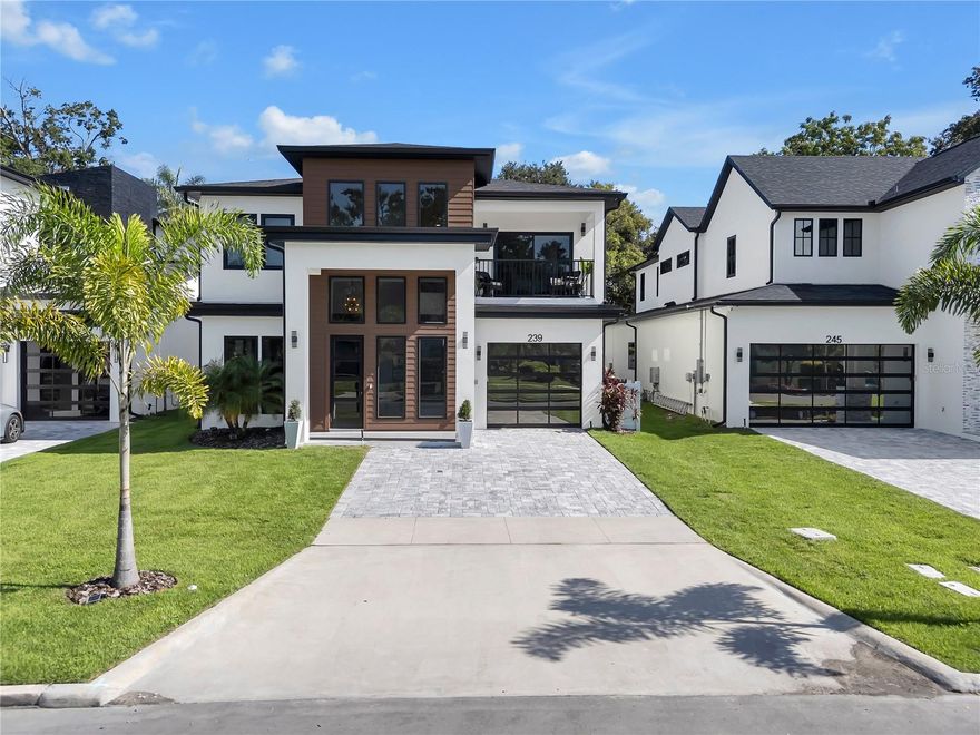 NEW CONSTRUCTION LUXURY INCOME PROPERTY — MINUTES FROM ORLANDO HEALTH

This NEW CONSTRUCTION four-bedroom, three-full, two-half-bath contemporary residence offers one of ORLANDO’S MOST COMPELLING LUXURY INCOME PROPERTIES—a LUXURY APARTMENT, SOLD AS A FULLY FURNISHED APARTMENT, generating $4,000–$5,000 PER MONTH from traveling medical professionals and INTERNATIONAL GUESTS.

The LUXURY APARTMENT features its own PRIVATE ENTRANCE, PRIVATE STAIRWAY, and SECURE ELECTRONIC ACCESS, ensuring complete privacy and separation while remaining seamlessly integrated into the home’s modern design. With ONLY 5-STAR REVIEWS, this suite consistently attracts HIGH-QUALITY TENANTS seeking comfort and privacy.

Inside the apartment, guests enjoy a COMPLETE KITCHENETTE, a SPA-QUALITY BATH with dramatic floor-to-ceiling stone and slat-wood tile, a striking backlit mirror, and a PRIVATE BALCONY—an elevated amenity that ENHANCES RENTAL APPEAL AND PRICING POWER.

This home offers FLEXIBLE RENTAL STRATEGIES for maximum return. Owners can RENT THE APARTMENT ALONE, LIVE IN THE MAIN HOME WHILE OFFSETTING THE MORTGAGE, or LEASE BOTH THE APARTMENT AND THE MAIN HOME SEPARATELY for strong COMBINED CASH FLOW. This flexibility positions the property as one of ORLANDO’S MOST COMPELLING LUXURY INCOME PROPERTIES.

The main residence opens with a SOARING 24-FOOT FOYER that sets the tone for its contemporary scale, natural light, and modern refinement. The main level includes FLEXIBLE SOCIAL AREAS, a formal dining room, and a living space anchored by a MODERN ALL-SEASONS FIREPLACE, CUSTOM SHELVING, WET BAR, and INTEGRATED SOUND SYSTEM.

At the heart of the home, the gourmet kitchen features a 10-FOOT WATERFALL QUARTZ ISLAND, Bosch APPLIANCES including DUAL REFRIGERATOR-FREEZERS, induction cooktop with pot filler, convection oven, microwave, dishwasher, WALK-IN PANTRY, and a DEDICATED COFFEE BAR OVERLOOKING THE POOL.

The upstairs level is centered around a LOFT that functions as a gathering, working, or flex space. It also creates a BUFFER FOR ADDED PRIVACY between the OWNER’S SUITE and the additional bedrooms.

The expansive OWNER’S SUITE is a true FOUR-ROOM SUITE, offering a DEDICATED OFFICE / FLEX SPACE, an OVERSIZED DRESSING ROOM, and a SPA-INSPIRED BATH featuring a FIVE-HEAD SHOWER and striking backlit mirror. Two ADDITIONAL OVERSIZED BEDROOMS share a BEAUTIFULLY APPOINTED FULL BATH WITH DUAL SINKS AND PRIVATE TUB/SHOWER AREA. A generous upstairs laundry room completes the level.

OUTDOOR LIVING includes a SPARKLING POOL, OUTDOOR KITCHEN, OUTDOOR SHOWER, and DEDICATED HALF BATH, all framed by terrazzo tile and designed for year-round Florida enjoyment.

The home features PREMIUM UPGRADES VALUED OVER $100,000, including HURRICANE-RATED IMPACT WINDOWS AND DOORS, DESIGNER LIGHTING, and additional LUXURY ENHANCEMENTS that further elevate style and long-term value.