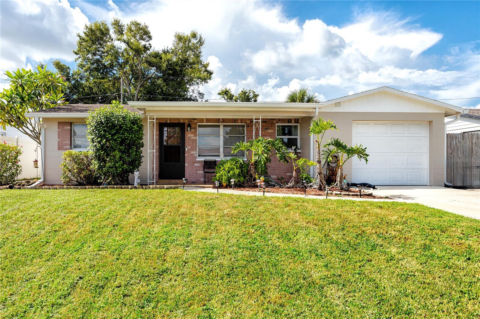 Welcome to this beautifully remodeled single-family home in the heart of Seminole—a rare find with no HOA and no rental restrictions, making it one of the few properties in the area fully open to short-term rentals and Airbnb hosting. Whether you’re searching for your next personal home in a sought-after neighborhood or an investment with strong income potential, this versatile property delivers.
Inside, the 3-bedroom, 1-bath layout has been thoughtfully updated to combine comfort and modern design. The open floor plan is anchored by new wood-look tile flooring throughout, creating a seamless flow from room to room. The kitchen is a showpiece with stone countertops, sleek cabinetry, and a subway tile backsplash that blends style with durability—perfect for everyday use or appealing to future guests. The bathroom has been fully updated as well, with matching stone counters, modern cabinetry, and a tub-shower framed in elegant tile. All major appliances convey, including a full-sized Samsung washer and dryer.
Recent upgrades add both value and peace of mind: a new roof in 2017, a 2018 AC system, a 2023 electrical panel, and sewer line replacement to PVC. Each improvement means less to worry about now and greater efficiency for years ahead.
The backyard offers endless possibilities! Create your own private retreat with a pool, entertaining patio, or lush garden—or design an outdoor space that enhances rental rates for visiting guests. A hot tub is already in place for relaxation, and the fenced yard ensures both privacy and functionality. Private sliding door access to the backyard can be found in the primary bedroom as well, and one-car garage adds storage and convenience.
Location is another key advantage. Seminole is known for its top-rated schools, community parks, and family-friendly atmosphere. Enjoy quick access to shopping, dining, and entertainment, plus easy routes to the Gulf beaches, St. Pete, and Clearwater. For investors, this area remains in high demand for both seasonal visitors and long-term tenants, offering strong rental income potential and future appreciation.
Don’t miss your chance to own a turnkey Seminole property with rare short-term rental flexibility. Whether you’re planning to make it your home base or add it to your investment portfolio, this gem offers the best of Florida living—both personal and profitable.