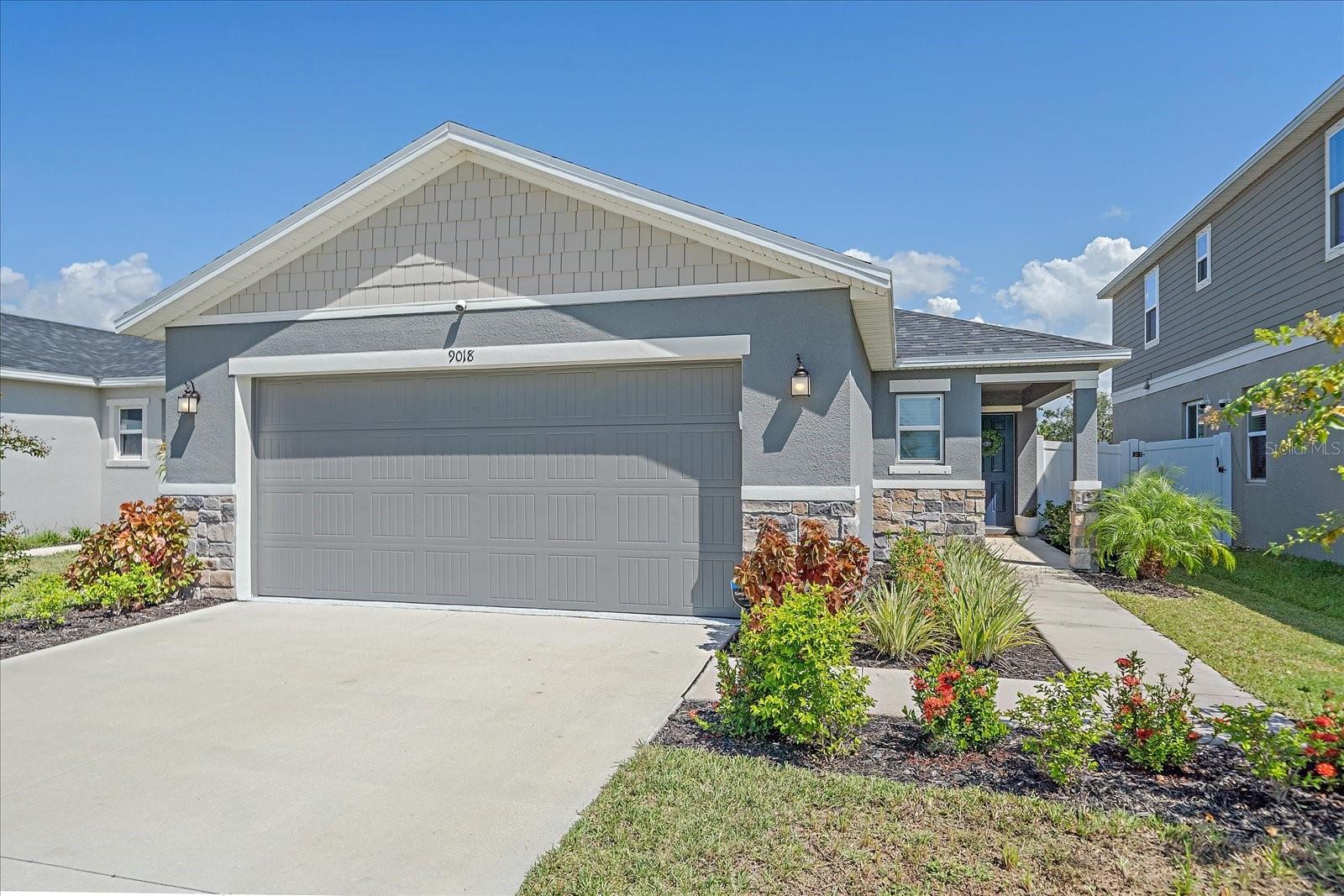 Welcome to this SPACIOUS 3 BEDROOM, 2 BATH HOME featuring an ATTACHED 2-CAR GARAGE and thoughtful UPGRADED FEATURES throughout. Unlike standard builder grade, this home boasts MODERN LIGHTING, STONE COUNTERTOPS, and TILE FLOORING in the main living areas. The inviting OPEN FLOOR PLAN flows seamlessly into a bright kitchen complete with STAINLESS STEEL APPLIANCES, perfect for entertaining or everyday living. The PRIMARY SUITE offers a private retreat with a WALK-IN CLOSET and a luxurious PRIMARY BATHROOM featuring DUAL SINKS.
Enjoy outdoor living on the SCREENED LANAI overlooking a FULLY FENCED YARD with OPEN GREEN SPACE behind the home for added privacy. The exterior is just as impressive with BEAUTIFUL STONE DETAILING and PROFESSIONAL LANDSCAPING. Additional conveniences include a dedicated LAUNDRY ROOM and access to a COMMUNITY POOL for year-round relaxation.
This home combines comfort, style, and function—truly a must-see!