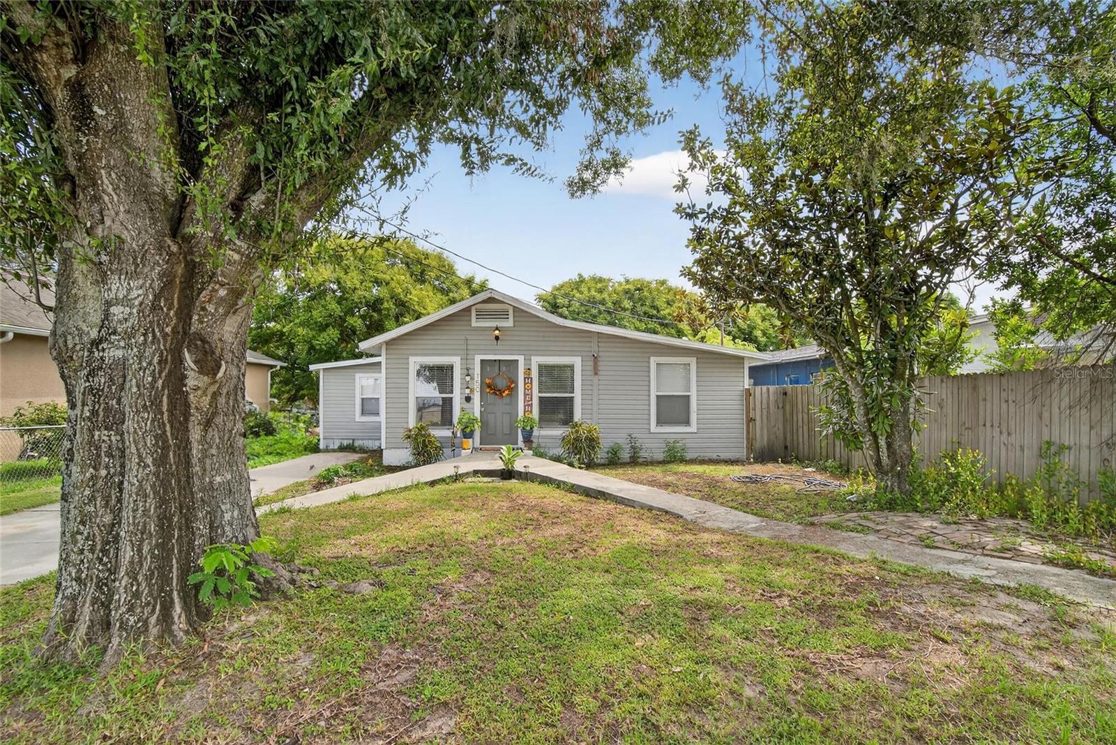 This fully renovated home offers the tranquility you’ve been searching for. Relax in the spacious living room with views of the neighborhood pond, or retreat to the cozy bedrooms for a well-deserved recharge. A versatile flex space provides extra room for kids, a home office, or hobbies.
Love to entertain? The expansive backyard is perfect for family gatherings, celebrations, or simply enjoying the outdoors. The long driveway offers plenty of parking—and with no HOA, you’ll have freedom without the hassle. Conveniently located near downtown, shopping, schools, medical facilities, government offices, and a community park with a playground just a mile away.
This home has been completely renovated in 2023, featuring luxury vinyl plank flooring, fresh stucco and siding, new windows, doors, light fixtures, ceiling fans in every room, and a hidden pocket door that separates the living area from the bedrooms—ideal for gatherings. Major updates include a new roof, HVAC system, and hot water heater.
Don’t wait—schedule your private showing today and make this move-in-ready home yours.