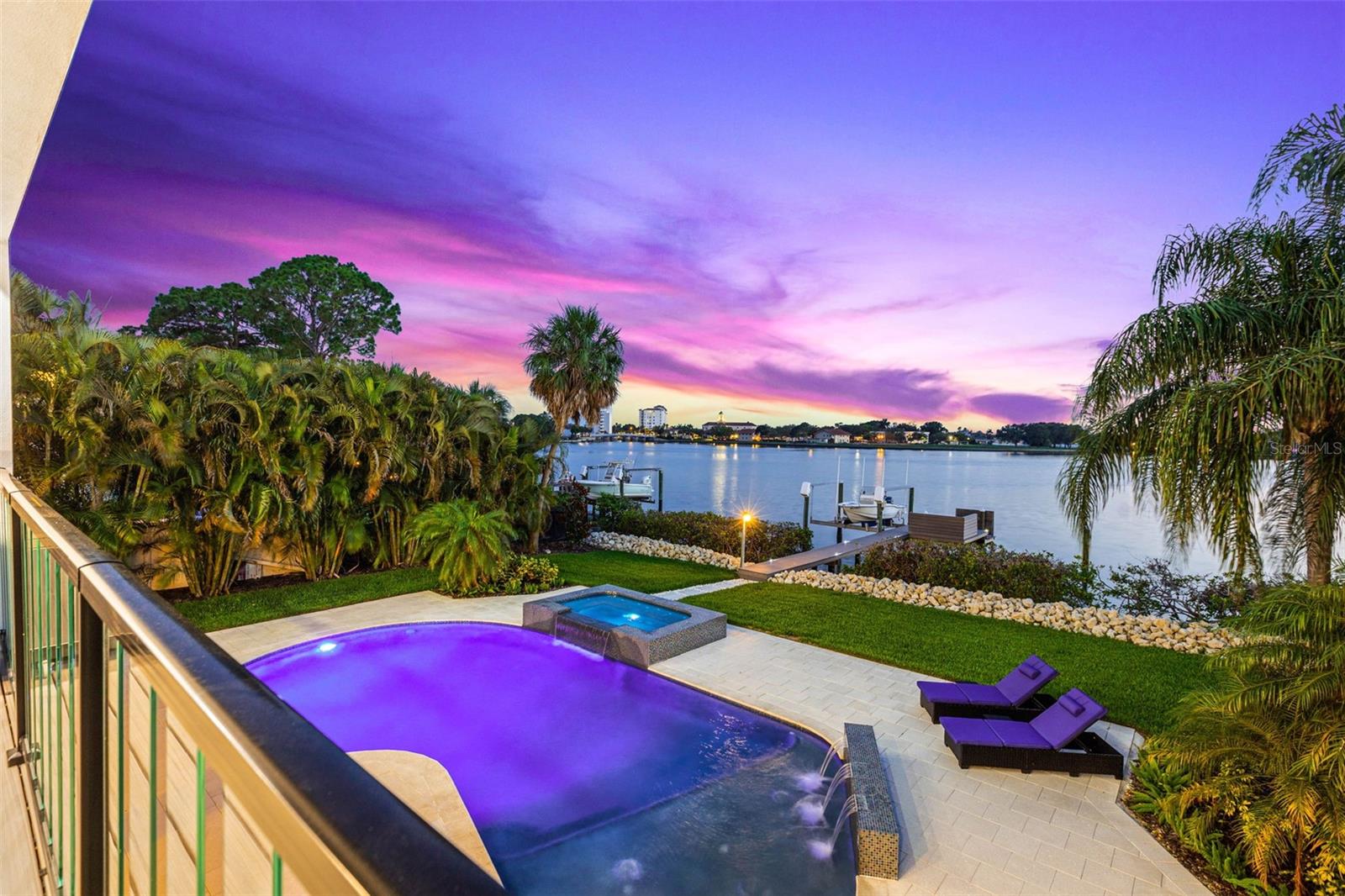 This stunning new construction home offers an unparalleled living experience, combining elegant design with breathtaking water views. Spanning 5,200 square feet, this residence boasts 5 bedrooms, five full bathrooms, and two half bathrooms. Step inside and discover a world of luxury.
The main level welcomes you with a large family room, complete with a cozy fireplace for those chilly evenings. The open layout seamlessly connects the living spaces, creating an inviting atmosphere for gatherings and relaxation. Need a space for entertainment? The sixth bedroom easily converts into a game room, providing endless enjoyment for family and friends.
The kitchen is a culinary enthusiast's dream, featuring a spacious layout, a large center island with extra seating, and European style cabinetry. The quartz countertops adorned with under-counter task lighting add a touch of sophistication. Premium stainless steel appliances, a wet bar, and a wine cooler complete this culinary haven.
Two master suites await you in this remarkable home. On the second level, you'll find a generously sized suite with all the amenities you desire. The third level boasts an extra-large suite, boasting his and hers custom closets, a large shower, and a standalone tub—your own personal oasis to unwind and rejuvenate.
Enjoy the convenience of a fully wired surround sound and WiFi connectivity system. Smart feature LED lighting, a sound system, and security cameras enhance your modern lifestyle.
The rear of the home beckons you to embrace outdoor living at its finest. Take in the expansive water view from the comfort of your composite dock and boat lift. The backyard oasis features a modern style pool with a spa, a fire pit for cozy evenings, and two outdoor kitchens equipped with gas grills. To top it off, a full pool bathroom ensures your convenience and comfort.
Additional features include two high-efficiency air conditioners with heat pumps, impact-rated windows and doors for added security, and beautifully landscaped grounds with an automatic sprinkler system.
Schedule your personal tour today and envision the lifestyle that awaits you in this remarkable home.