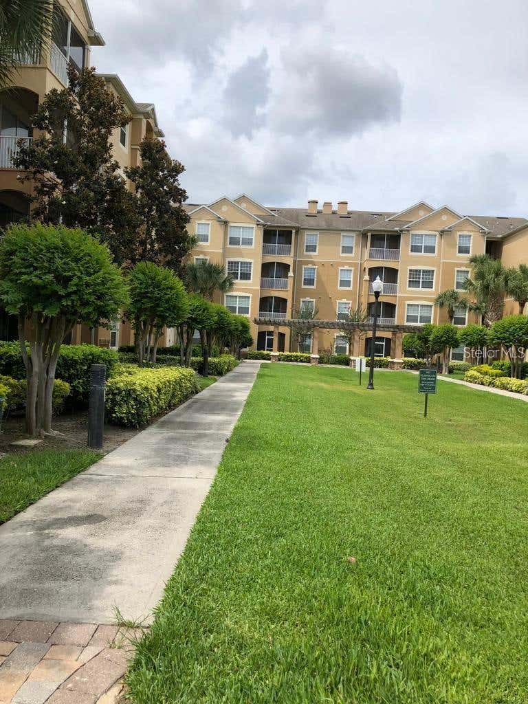 Photo of 6466 Cava Alta Drive #104, Orlando, FL 32835 (MLS # O6415898)