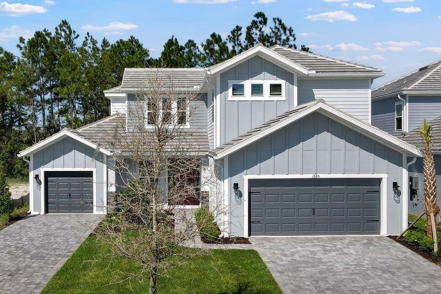 What's Special: 1st Floor Primary Bedroom | High Ceilings | 1st Floor Guest Suite. New Construction – Ready Now! Built by Taylor Morrison, America’s Most Trusted Homebuilder. Welcome to the Tortola at 1685 Trailhead Lane in Hammocks at Two Rivers! Meet this open-concept design home filled with natural light and thoughtful details. A soaring two-story foyer creates a stunning first impression, while a private bedroom with its own bath is tucked away for guests. At the heart of the home, the great room opens to an extended lanai through pocket sliding glass doors, blending indoor and outdoor living. The kitchen features a large island, walk-in pantry, and plenty of storage, with a dining area nearby for easy gatherings. The first-floor primary suite offers a spa-like bath with a soaking tub, walk-in shower, dual sinks, and a spacious closet. Upstairs, you will find three secondary bedrooms and a large game room for endless fun. Located in The Hammock at Two Rivers, you will enjoy resort-style amenities including a planned health club, racquet sports, pools, dining, and more, all in a prime Zephyrhills location near beaches, shopping, dining, and major attractions in Tampa and Orlando. Additional highlights include: gourmet kitchen, pocket sliding glass door in the great room, an extended covered lanai with an outdoor kitchen rough-in, laundry tub rough-in, tray ceilings, and open stair railing.  MLS#TB8430587