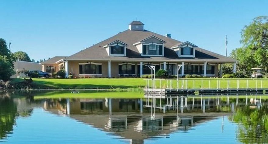 One or more photo(s) has been virtually staged. A rare opportunity to own a private, gated 52-acre lakefront estate offering scale, privacy, and architectural presence—strategically located along State Road 60 between Tampa and Lakeland.

A long, winding drive framed by blooming azaleas, mature lychee trees, and classic Old Florida landscape sets the tone as you arrive at this extraordinary legacy property. At its heart lies a pristine, seven-acre private lake, creating a resort-like setting just steps from the residence—ideal for morning coffee, fishing, paddleboarding, or sunset views across open water.

The 9,349-square-foot custom two-story home was designed for both grand entertaining and comfortable everyday living. A wraparound porch, multiple sets of sliding pocket doors, and seamless indoor-outdoor flow connect the home to a screened resort-style pool and spa, expanding the living space into nature.

The primary kitchen anchors the home and was thoughtfully designed for large gatherings, featuring Thermador appliances, double ovens, warming drawer, dual sinks, an oversized center island, bar seating, lead-glass cabinetry, and a walk-in butler’s pantry with custom storage. A secondary kitchen located off the sunroom provides additional flexibility with a gas range, wine refrigerator, and direct pool access.

The expansive primary suite offers lake views, a private fitness room with wet bar, custom dressing rooms, and a spa-style bath with dual water closets—creating a true owner’s retreat. Additional features include a large custom laundry room, built-in vacuum system, skylit roofing, and thoughtful architectural details throughout.

Beyond the residence, the property functions as a true estate compound. A 5,000-square-foot metal barn with loft, two bays, office, and half bath provides versatility for car collections, equipment, hobbies, or business use. Infrastructure highlights include a 105kW Generac generator, a 12” deep irrigation well (675’), extensive road frontage, and three separate ingress/egress points, offering future flexibility.

Mature exotic fruit trees—including lychee, avocado, mango, banana, and pomelo—enhance the property’s self-sustaining appeal. With 1,428 feet of frontage on State Road 60, this estate combines privacy with accessibility: approximately 10 miles to Lakeland Linder International Airport and convenient access to I-4 and I-75.

Properties of this scale, privacy, and lakefront presence rarely come to market. Ideal as a luxury residence, multigenerational estate, private retreat, or legacy investment in one of Central Florida’s most strategic corridors.