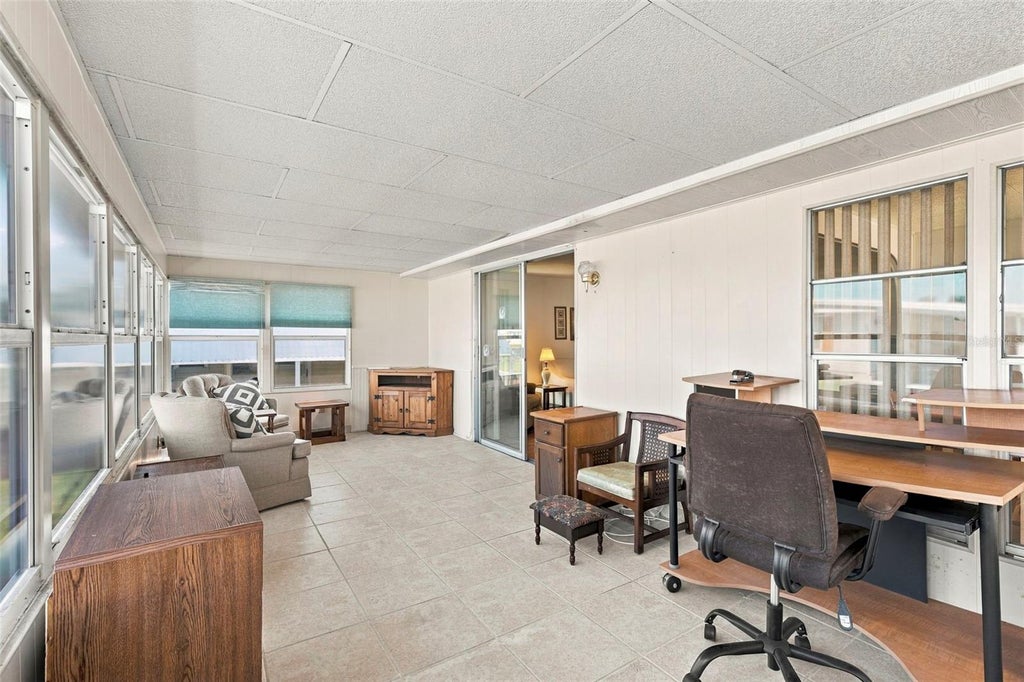 Photo of 10444 Peaceful Drive #350, Largo, FL 33773 (MLS # TB8557873)