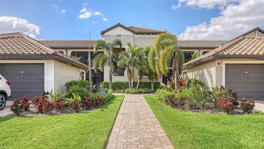 One or more photo(s) has been virtually staged. WELCOME to the exclusive gated community of Lakewood National.  Situated perfectly off the 1st tee, with views of the stunning Arnold Palmer designed golf course and a quick stroll to the wealth of amenities Lakewood National World Class Golf Community provides. Tennis, pickleball, community pools- the unique Arabella floor plan in the veranda style condominium is the largest floor plan available and comes equipped with a one car garage. Enjoy the modern finishes, high end appliances. Retreat to the primary bedroom with a large walk-in closet, en suite bathroom with space galore. The enhanced privacy of a split plan with a den in the middle, has been equipped for a lifestyle that includes a workspace and guest accommodation (but not too much!) Time spent on the lanais, both of which are screened, will be a break only from the ultimate golfing lifestyle, with the chip and putt very close by. A separate resort style pool is right across the street as well. The tiki bar, pickleball courts, tennis, bocce ball, as well as a 24 hour fitness center and full service spa are around the corner. Whether you are on an extended vacation or looking at options for moving to the area, experience the area’s most sought after community!  The membership fee of $642.00 and a monthly food and beverage minimum of $65.00 are required.  
Call, email or text! won't last long because the KORNE FAIRY event is amazing!!  
Times vary but see how close all the area Attractions are!
SRQ Airport 11 mi 33 min
TPA Airport 44 mi 50 min
Nathan Benderson Park / new Mote SEA 6–7 mi 15–18 min
Sarasota attractions & beaches 25 mi 35–40 min
Anna Maria Island      12 mi     22-27 mins  
Mote Marine Aquarium (City Island) 25 mi 35 min
Marie Selby Botanical Gardens 25–27 mi  35 min
St. Armands Circle / Lido Key area 26 mi 38 min
Siesta Key Beach 25 mi 35 min
Sarasota Jungle Gardens 25 mi 35 min
Waterside at Lakewood Ranch  Lakefront master planned village  8 10 mi  15–18 min  
Nathan Benderson Park / new Mote SEA 6–7 mi 15–18 min
Venice, FL  36 mi 40 min
Disney World Resort 101 mi 1 hr   42 min