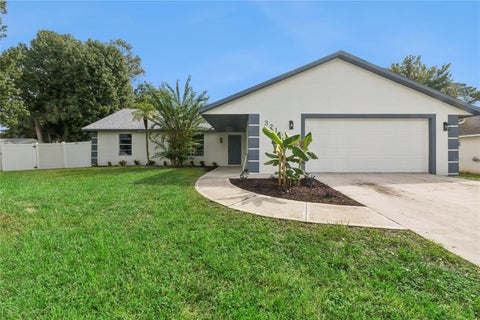 Photo of 3211 Travelers Palm Drive, Edgewater, FL 32141 (MLS # O6443024)