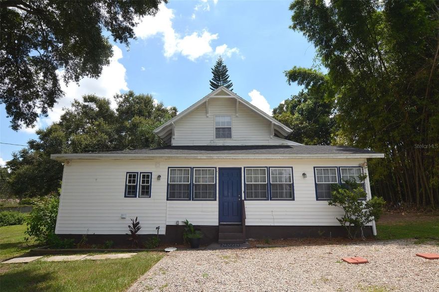 If you are looking for a little bit of country living but don’t want to be far from the city then you must see this adorable, 3 bedroom, 2.5 bathroom, south Lakeland home built in 1925 that sits on 1.65 acres. This recently remolded home boasts a stunning kitchen with granite countertops, soft close cabinets, stainless appliances, subway tile backsplash, and Luxury Vinyl Plank floors. The master suite has a large walk-in closet and a spacious updated bathroom with a dual sink vanity. You will not find many homes in this area with a lot of this size. Enjoy relaxing and entertaining outside with plenty of room to spread out under the camphor and oak trees. The property also has banana trees, avocado, peach, palms, bamboo, and a beautiful bougainvillea hedge. Bring your ducks and chickens to enjoy the pond and the aviary that is attached to the back of the garage. The septic system was replaced approximately 2 years ago and the roof was replaced approximately 3 years ago. The seller is willing to give a credit for the upstairs carpets. This home is conveniently located to several parks, restaurants, shopping centers, grocery stores, Cleveland Heights golf course, and the Polk Parkway for easy commutes to Tampa and Orlando. Call today to set up your private showing of this unique Lakeland home!