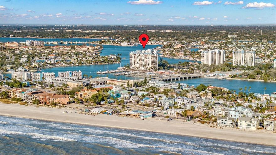 OVERSIZED 2/2 WATERFRONT UNIT in popular gated Yacht & Tennis Club of St Pete Beach, beautifully set on 13 pristine acres just steps from the award-winning local beaches of Treasure Island!  Enjoy almost 100 square feet of extra interior space in the main living area with this unique layout in the sought-after direct waterfront Intrepid building.  This unit features tasteful updates to kitchen and baths along with a handy window seat area in the kitchen offering extra storage.  Water Heater (2025).  HVAC (2021).  Storm shutters provide added protection and peace of mind.  Tile floors add an easily maintained coastal feel to complement the soothing coastal color palette in this immaculate well-maintained unit.  Primary ensuite bedroom features a walk-in closet with plenty of space for a king bed or even to add an additional closet if desired.  From inside the unit, experience a serene tropical feel as you gaze out at the gorgeous sparkling waters of the Intracoastal Waterway framed by tropical trees and foliage.  The community is extremely well maintained, and boasts a brand new seawall/boardwalk/docks, re-nourished HarTru tennis courts with two lined for pickleball, new gate access equipment, updated clubhouse and activity room, state-of-the art fitness facility and the heartbeat of the community - the heated waterfront pool and spa.  Enjoy mens/women's saunas, shuffleboard and a dedicated grilling area, and be pleasantly surprised at the active social scene managed by the fabulous volunteer social committee.  The community is also nearing completion of a substantial landscaping update, with all projects fully funded.  The building has passed the Milestone Engineering Study and the Structural Integrity Reserves requirements, and is in excellent financial health.  Close to public transportation and a hop and a skip from trendy downtown St Pete, this luxury condo community is ideally situated for your full time home or as a second home or investment property.  Include this unit in your showing schedule and you will be very happy you did!  Sold turnkey, so ready for immediate occupancy!