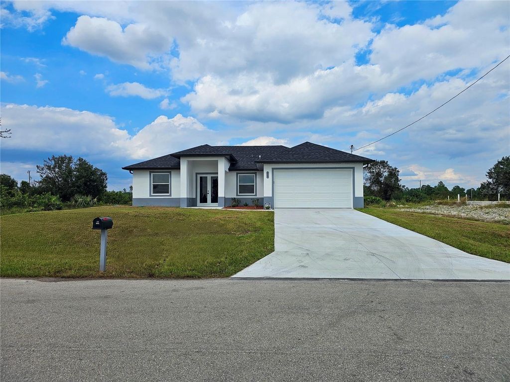 Photo of 3367 Meadow Road, Lehigh Acres, FL 33974 (MLS # C7499638)