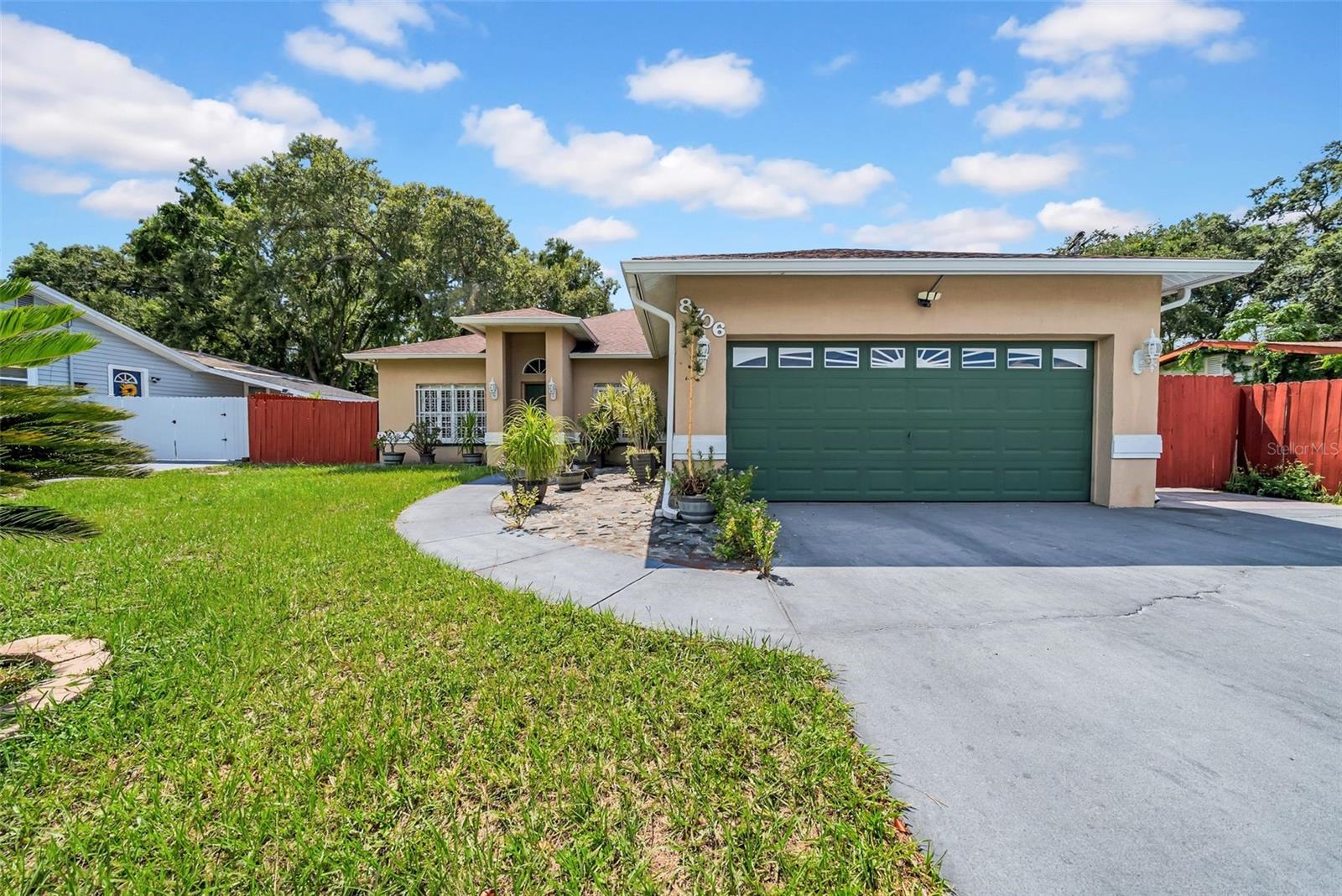 Welcome this spacious, custom-built 4-bed, 3-bath home in the heart of Temple Terrace, just minutes from Busch Gardens and central Tampa. With 2,345 square feet of living space, soaring ceilings, and elegant crown molding throughout, this home offers comfort, style, and versatility in one of Tampa’s most convenient neighborhoods.
Step inside to discover tile flooring throughout the main living areas, plush carpeting in the bedrooms, and high-end finishes like granite countertops and dark wood cabinetry in the kitchen. A built-in water filtration system adds convenience, while the whole-home water softener system ensures extra care for your appliances and lifestyle.
The oversized primary suite was expanded to create a retreat-like feel, offering ample room for rest and relaxation. One of the home’s most exciting features is the fourth bedroom and third full bath, currently connected through glass doors off the dining area. With plumbing already installed for a kitchenette, it’s ready for a mother-in-law suite, guest quarters, or private rental opportunity.
Outside, mature landscaping surrounds the property, with motion-sensor lighting, a large storage shed, a full security system, and Ring doorbell all in place for comfort and peace of mind.
Lovingly maintained by its original owner, this home offers a rare blend of location, layout, and lifestyle flexibility.