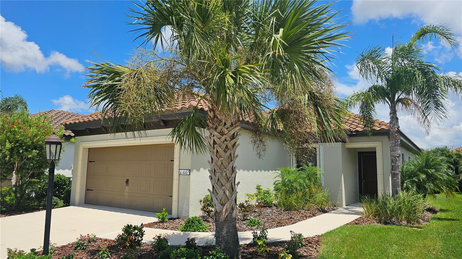Welcome to this impeccably maintained, like-new home nestled within a tranquil gated community built by renowned Neal Homes. This peaceful neighborhood offers low HOA fees and boasts resort-style amenities, including a modern clubhouse complete with a fireplace and a full kitchen, courts for pickleball and bocce ball, and a large, resort-style community pool. Inside the home, you’ll find three bedrooms and two full bathrooms, including a spacious primary suite with a generous walk-in closet. The interiors were just freshly painted, and the exterior was professionally power washed, making this home truly move-in ready. The open-concept kitchen is designed for both functionality and style, featuring Corian countertops, a large pantry, and brand-new stainless steel appliances—including a natural gas range and premium KitchenAid refrigerator. An adjoining dining area provides the perfect spot for family meals or entertaining. The oversized laundry room offers ample space and accommodates a full-size washer and gas dryer. Step outside to a screened lanai outfitted with a tropical-style ceiling fan, perfect for enjoying Florida evenings. Just steps away, the neighborhood pond offers leisurely catch-and-release fishing. Additional highlights include hurricane shutters, a security system, and the advantage of being located in an X flood zone—meaning no flood insurance is required. Conveniently situated close to schools, a fire station, and just 12 minutes from the beach, this home is also minutes away from the new Sarasota Memorial Hospital on Laurel Road and offers easy access to I-75 for commuting. This home delivers the ultimate combination of comfort, convenience, and lifestyle. Don’t miss out on the opportunity to make it yours!