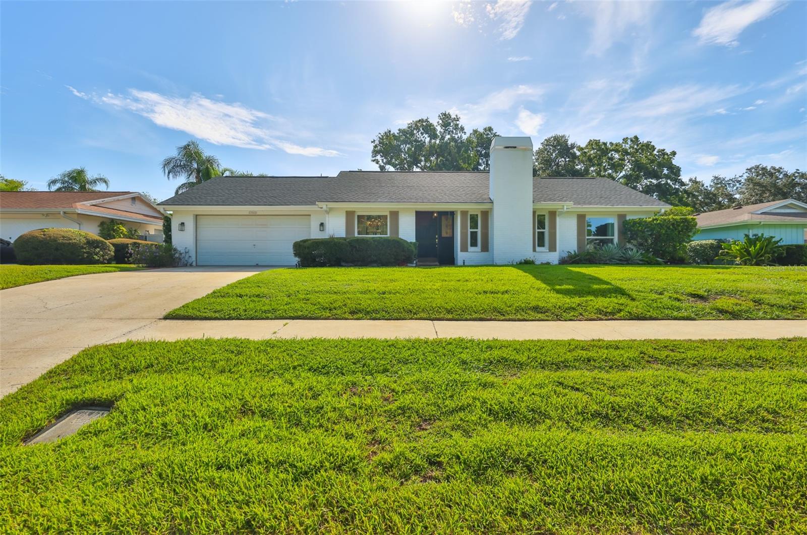 Location! Location! Location! Discover this well maintained 3 bedroom, 2 bath home in the highly sought-after Lake Magdalene area. Step inside to find timeless details and thoughtful upgrades throughout. The formal dining room features custom crown molding, parquet flooring, and picture window that fills the space with natural light. The spacious great room features warm wood floors, wood-burning fireplace framed by a stylish brick accent wall with direct access to the bright and comfortable Florida Room. The kitchen offers abundant wood cabinetry, generous counter space, cozy dinette, new Samsung Bespoke Smart Appliances and amazing view overlooking the lush backyard. For added privacy and comfort, all bedrooms are located on one side of the home, creating a peaceful retreat away from the main living areas. The oversized primary suite is tucked in the rear for peace and comfort and is complete with walk-in closet, crown molding, and access to Florida Room. The ensuite features dual sinks, a walk-in shower, and French doors leading to a private courtyard. Relax year-round in the air-conditioned Florida Room with brick pavers, or head outdoors to your backyard oasis featuring an oversized pool and patio adorned with brick pavers and charming pergola for al fresco dining, two storage sheds (one with electric) and fully fenced yard for privacy. The large components have been taken of: POOL DECK RESURFACED 2025, POOL PUMP 2024, HVAC 2023, ROOF 2022, ENERGY EFFICIENT WINDOWS 2022, SAMSUNG SMART APPLIANCE PACKAGE 2022, SOLAR WATER HEATER 2020 and newer water softener system. Perfectly situated in an amazing neighborhood and area close to shopping, dining, schools, major highways, and only 20 minutes from Tampa International Airport. This home is a MUST SEE! Schedule your private showing today and say yes to this address!
